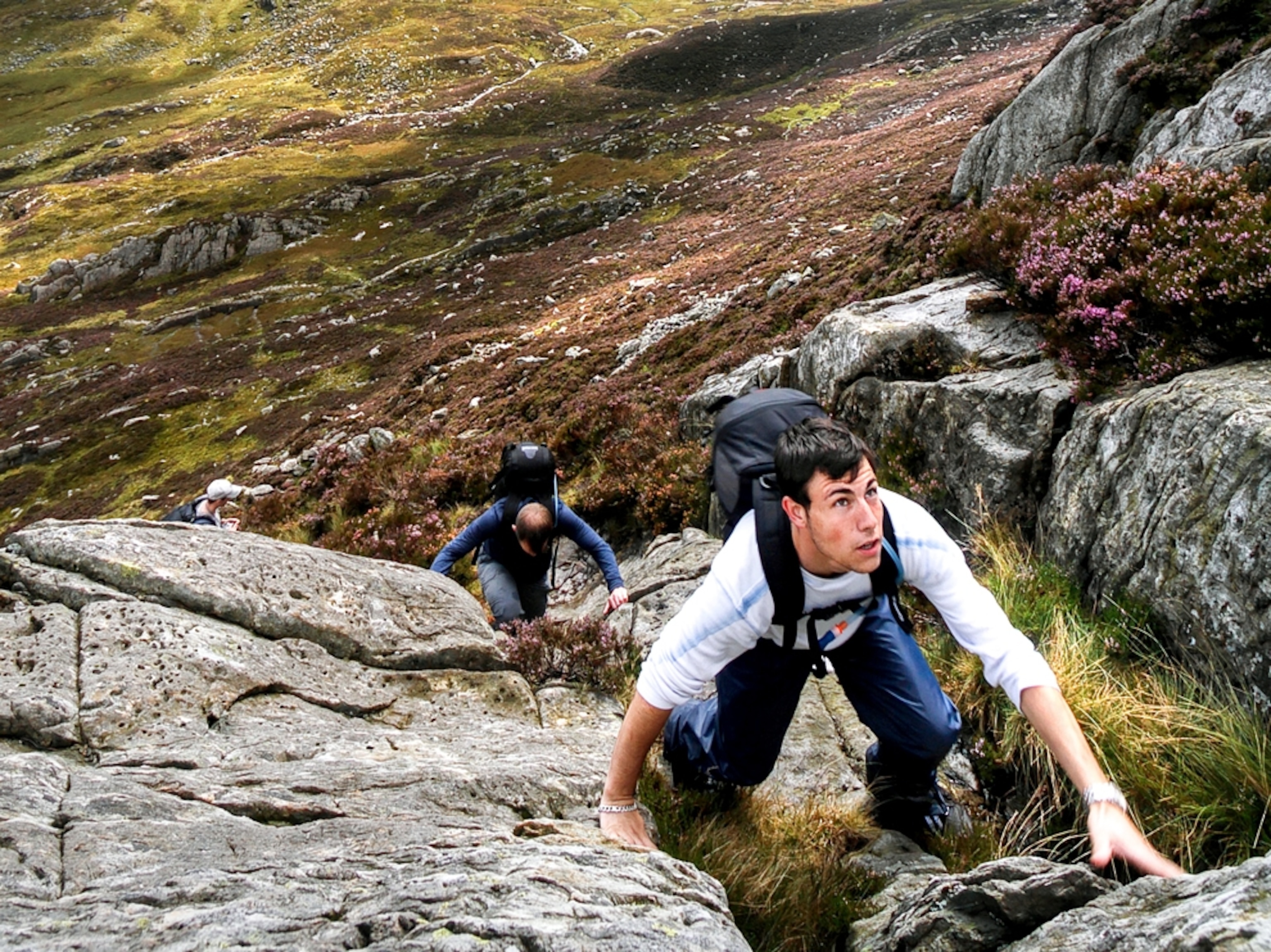 Two men climbing Tryfan Mountain