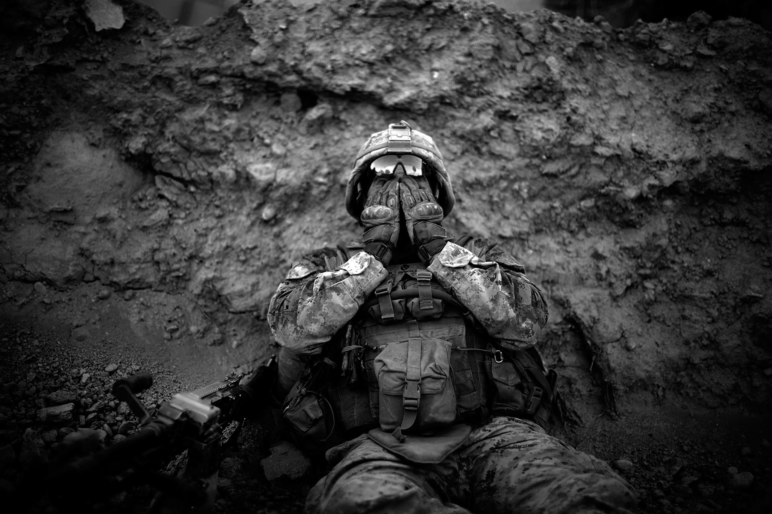 Marine Lance Cpl. Anthony Espinoza wipes the sweat out of his eyes