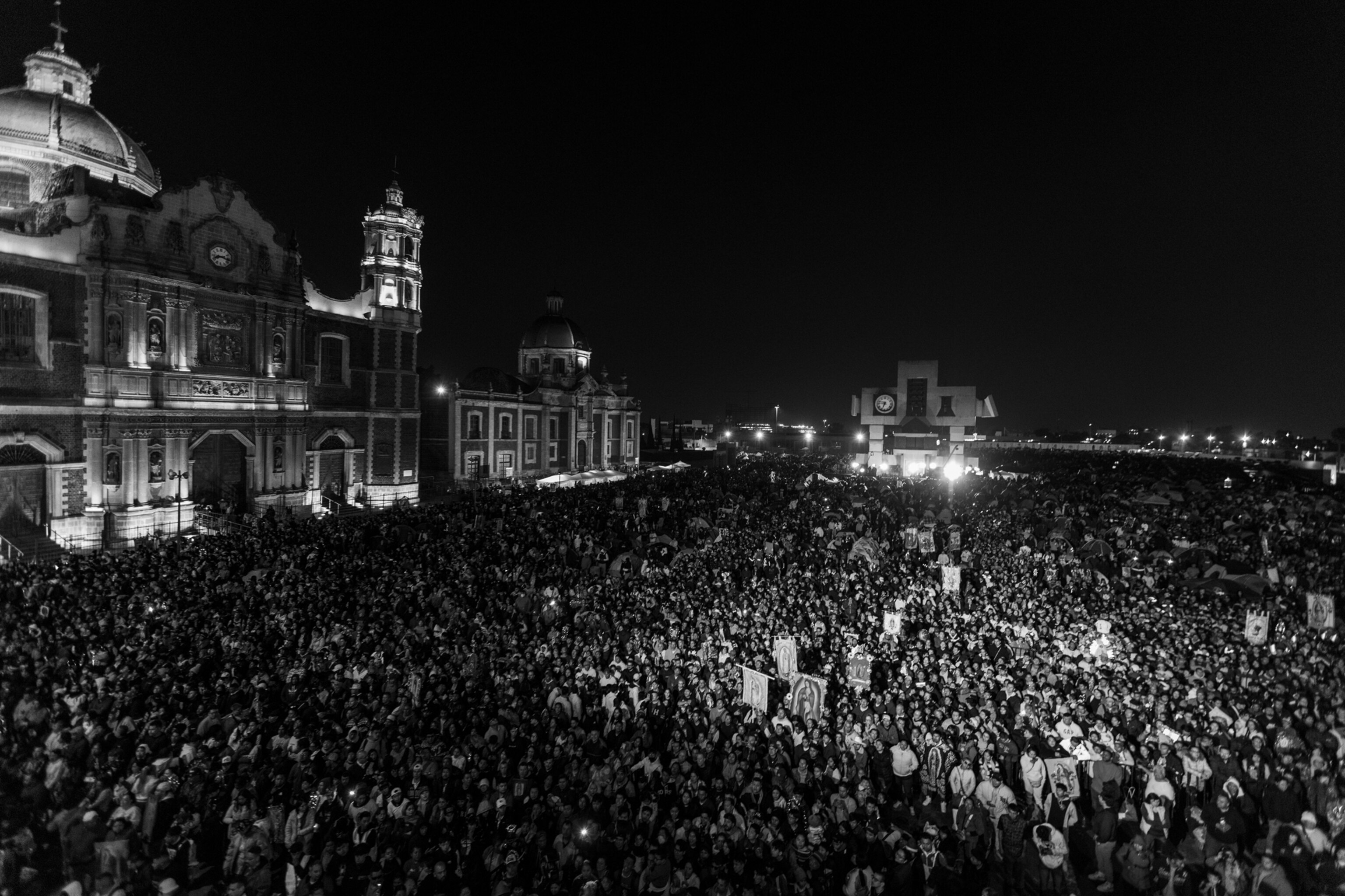 A large crowd gathers outside of a church