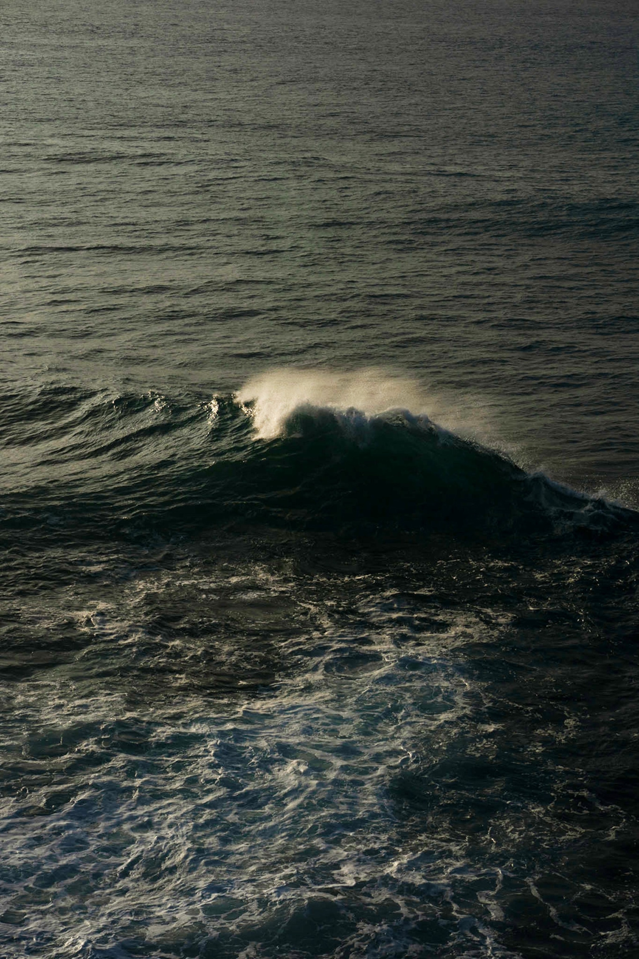 Beach waves crashing in Maui, Hawaii.
