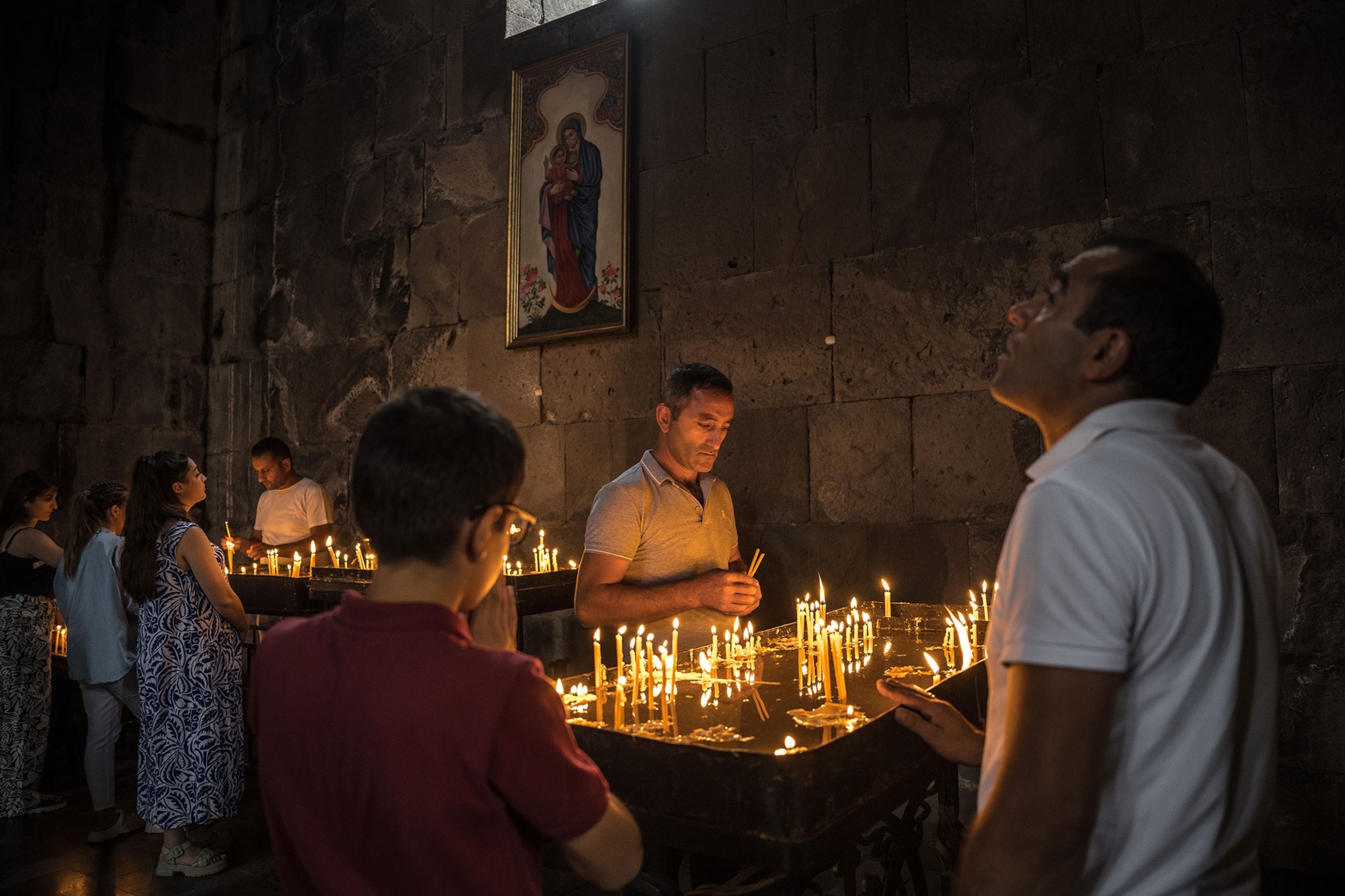 Armenians pray at a monastery in Tatev.