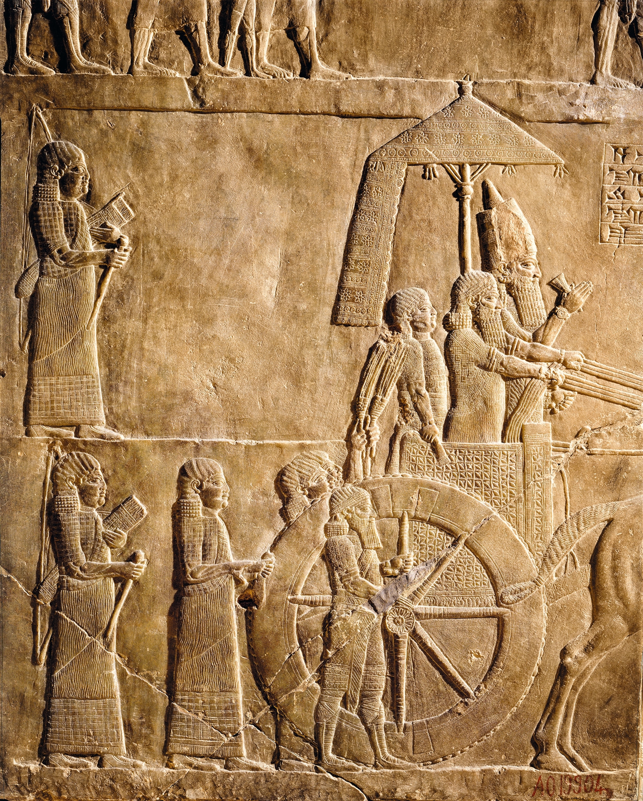 A relief of a charioteer accompanying Ashurbanipal.