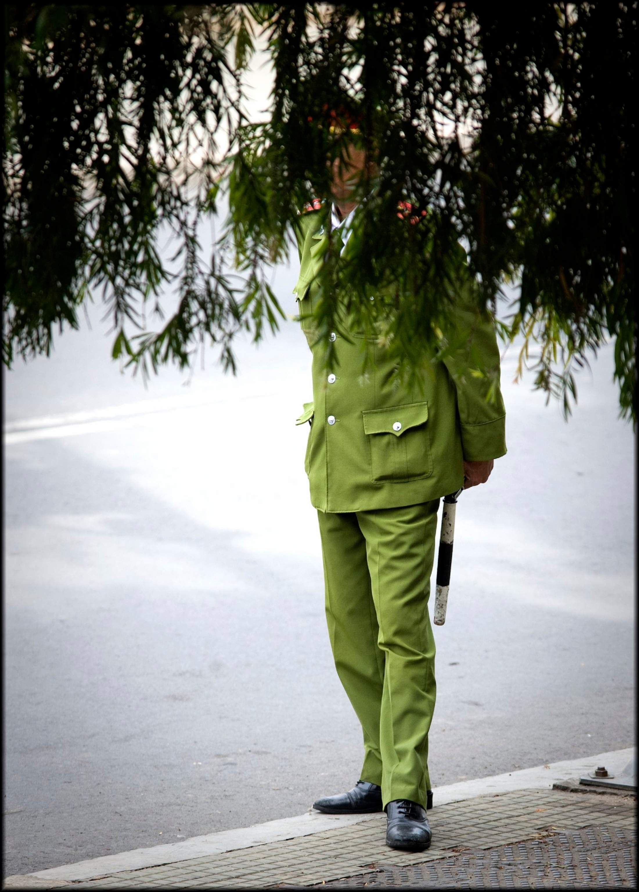 policeman in vietnam covered by trees