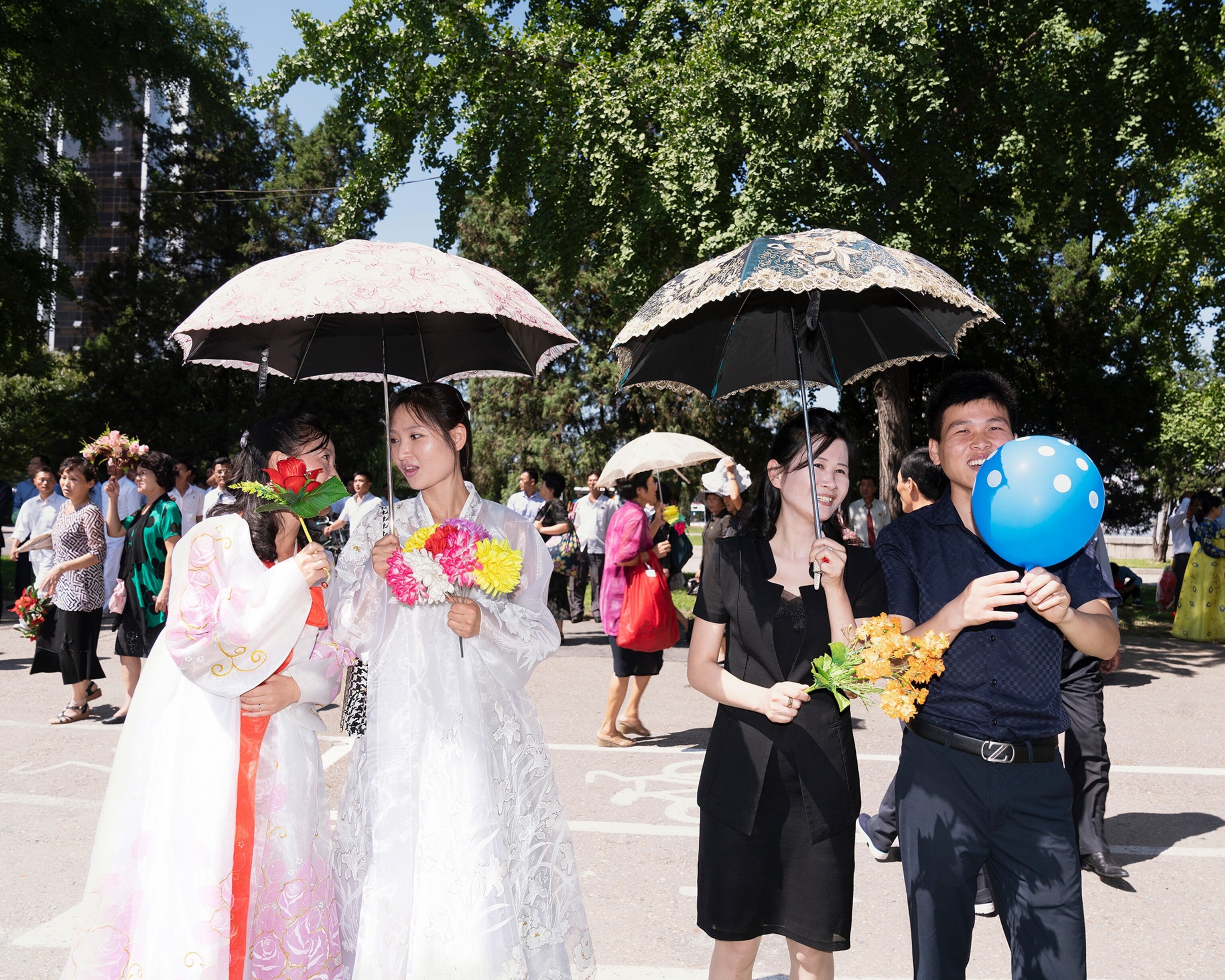 people participating the parade for the 70th anniversary of North Korea