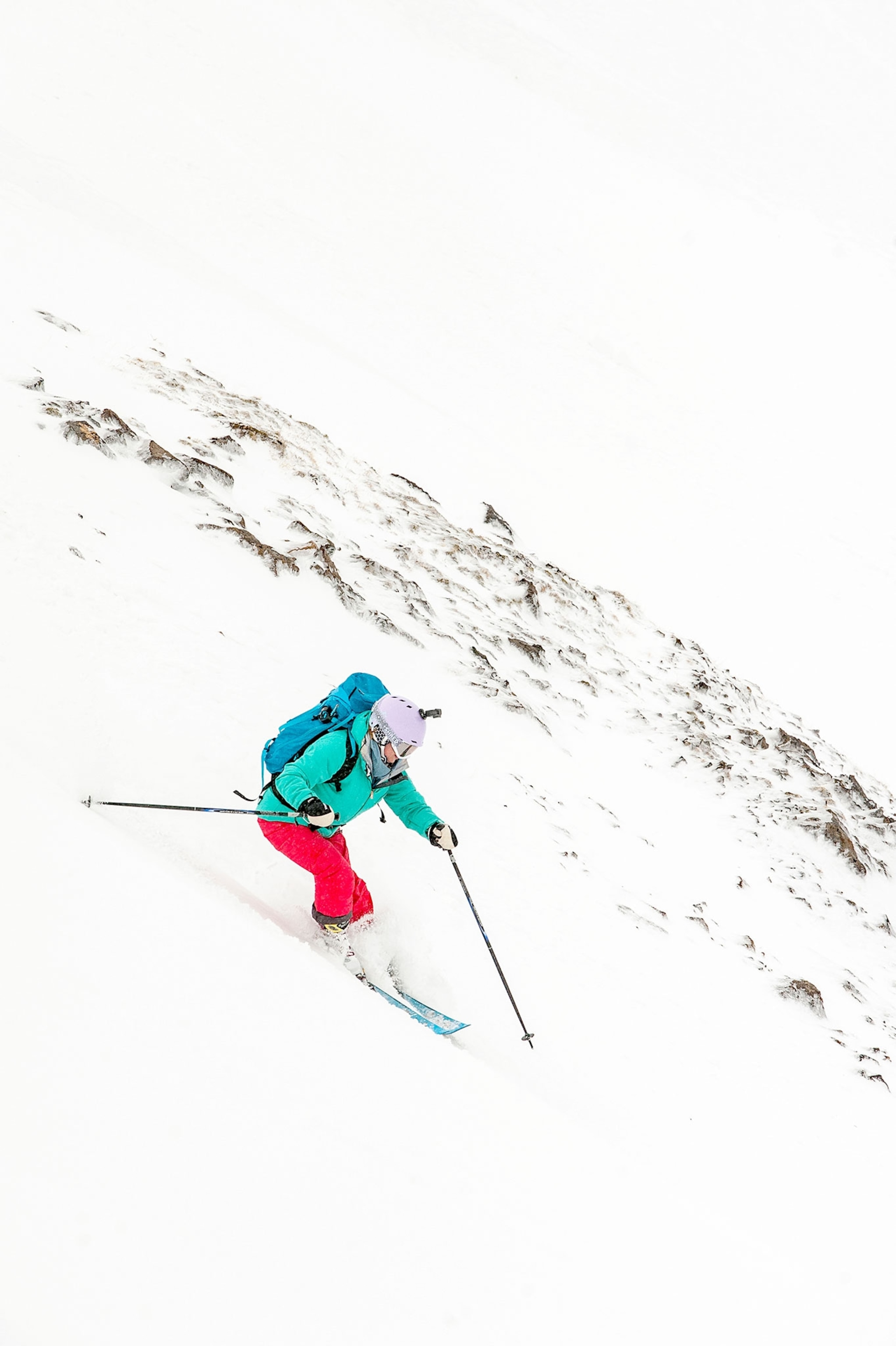 skier skiing down to a fjord in Iceland