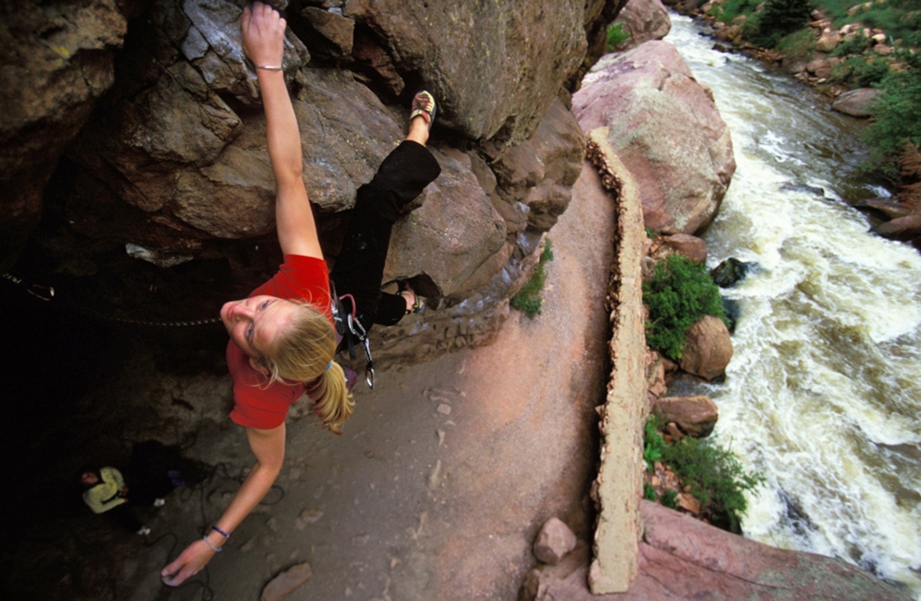 young woman rock climbing