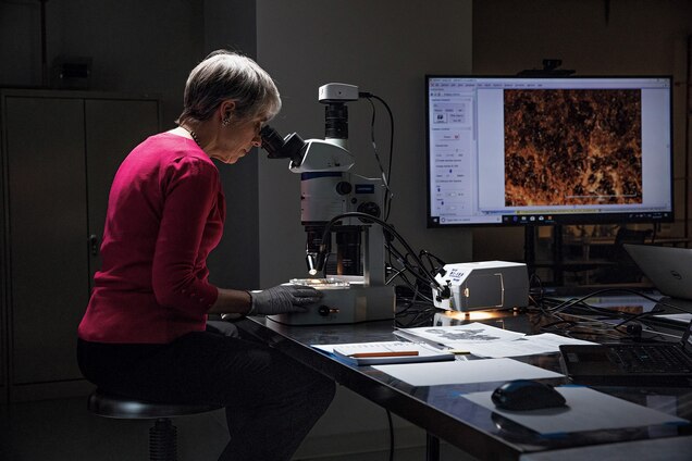 Investigator Abigail Quandt, head of Book and Paper Conservation at Baltimore&rsquo;s Walters Art Museum, examines a fragment of the Book of Genesis.