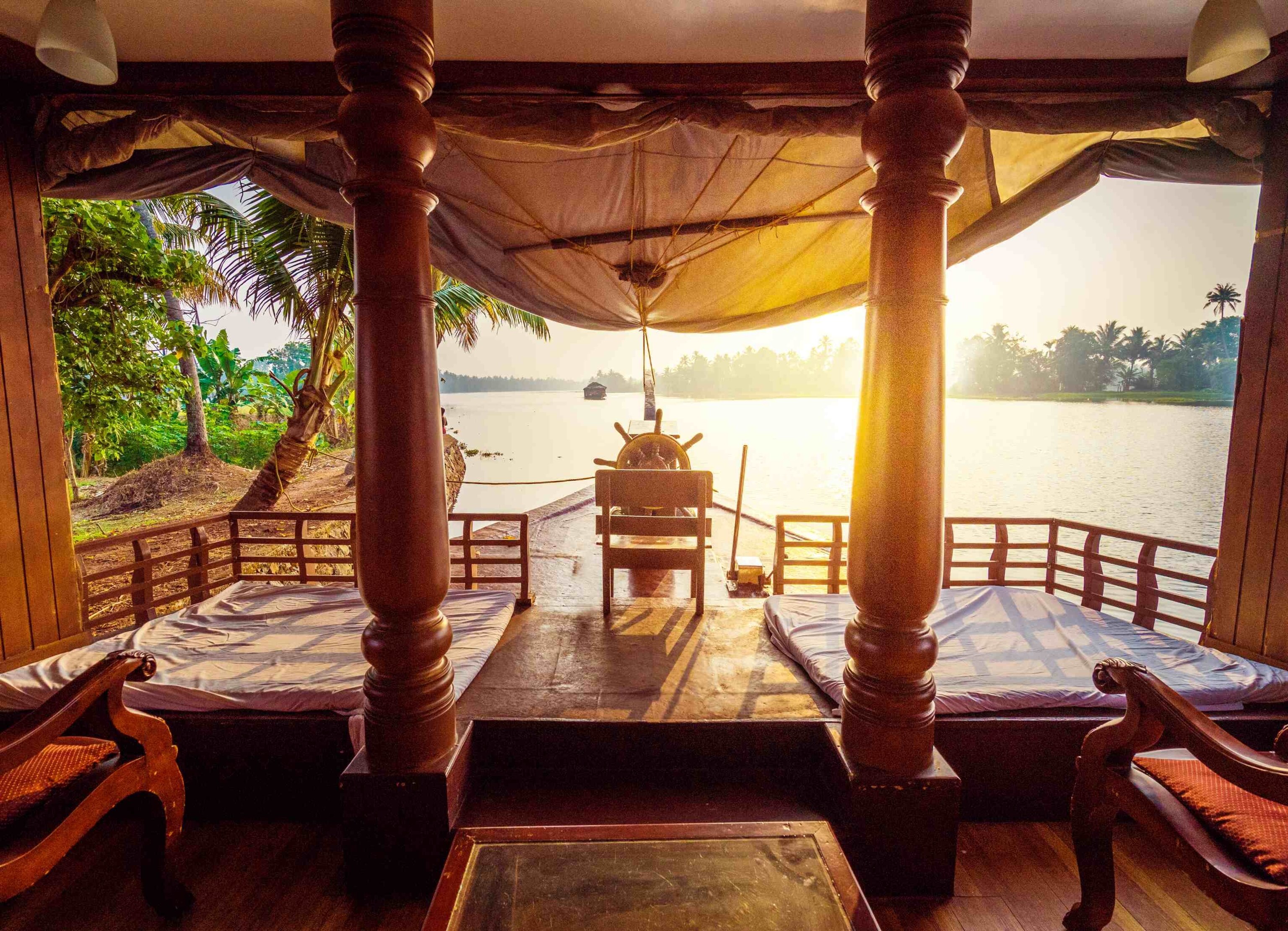 luxury houseboats covered verandas, teak floors, and fine furnishings