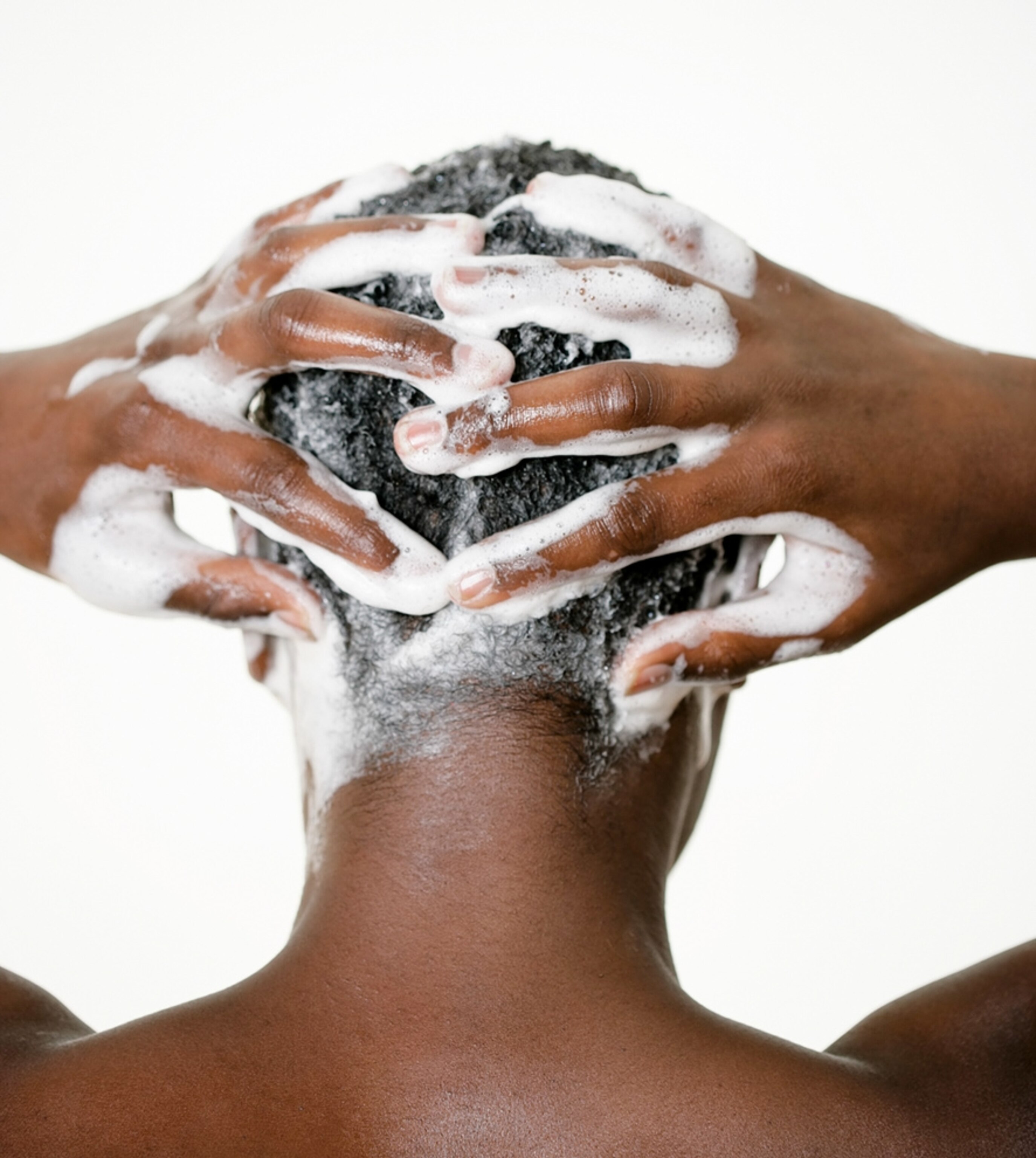 A man washes his hair.