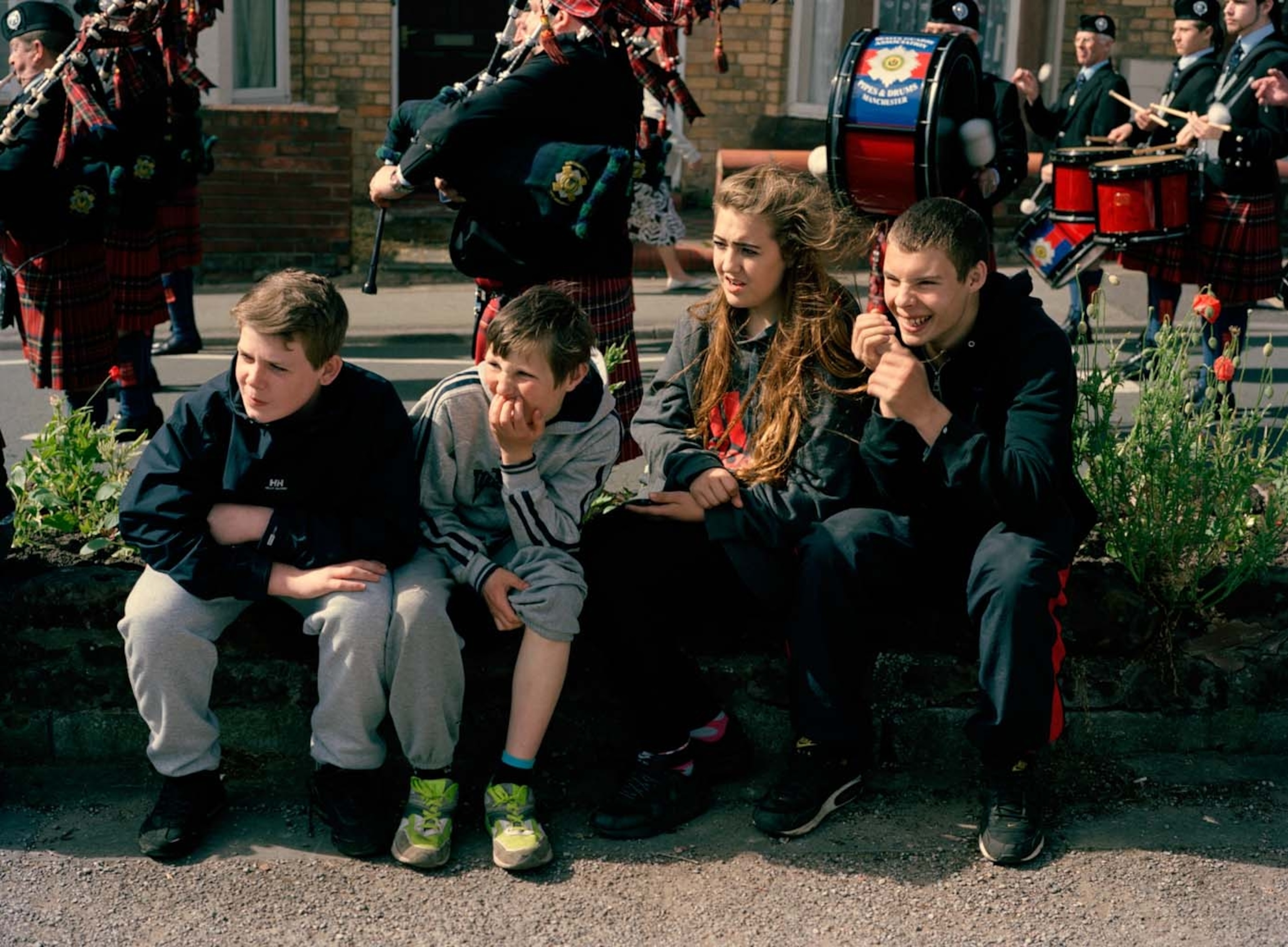 teens sitting on curb
