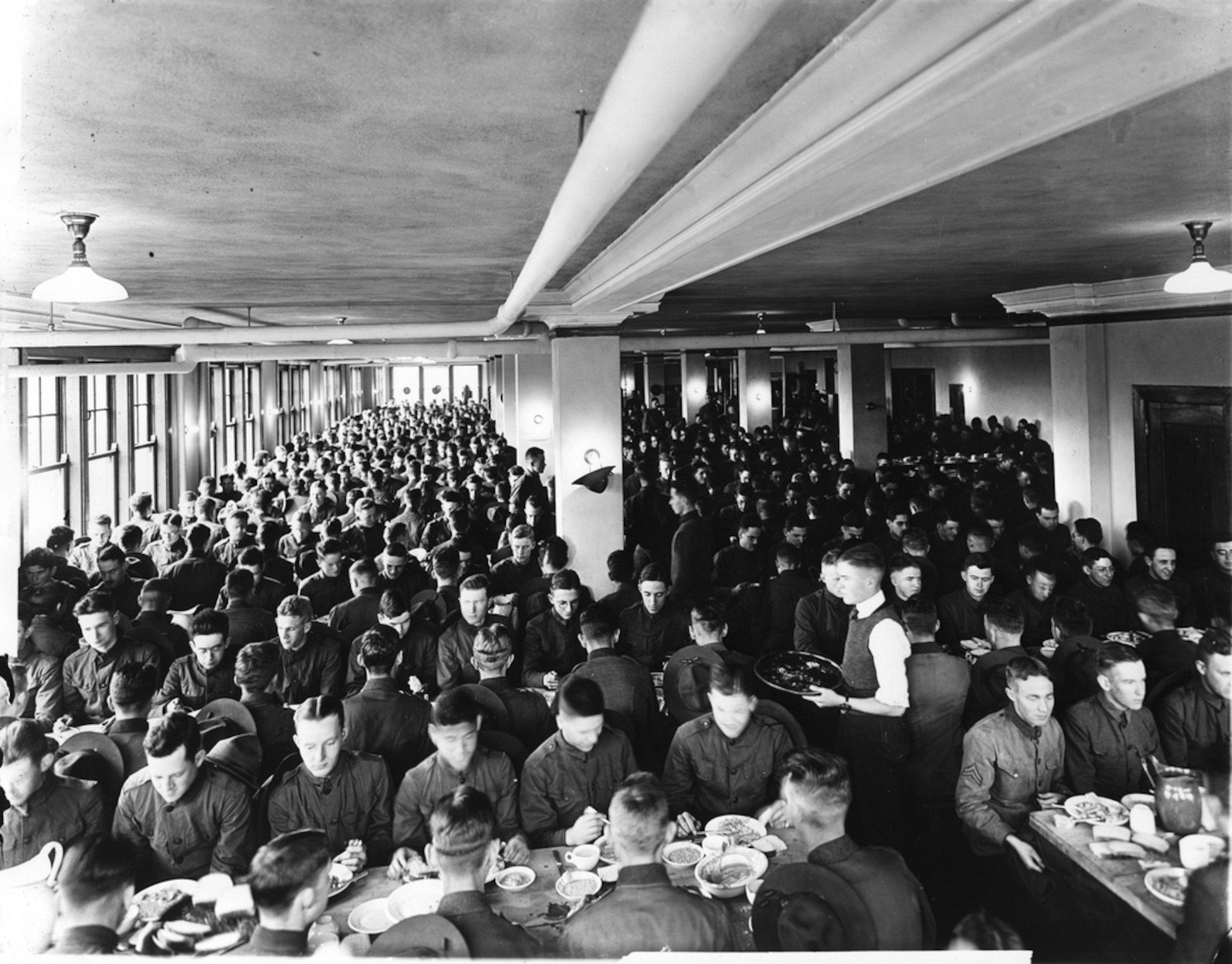 servicemen eating in the home ec cafeteria at Cornell.