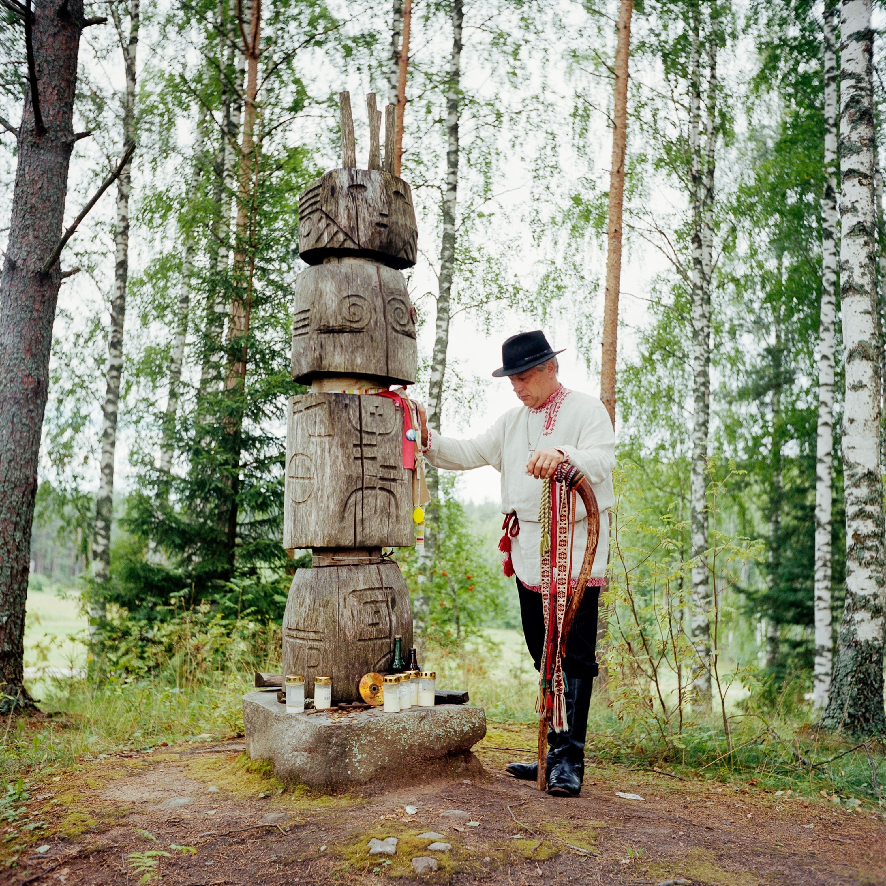 a man standing with a representation of Peko