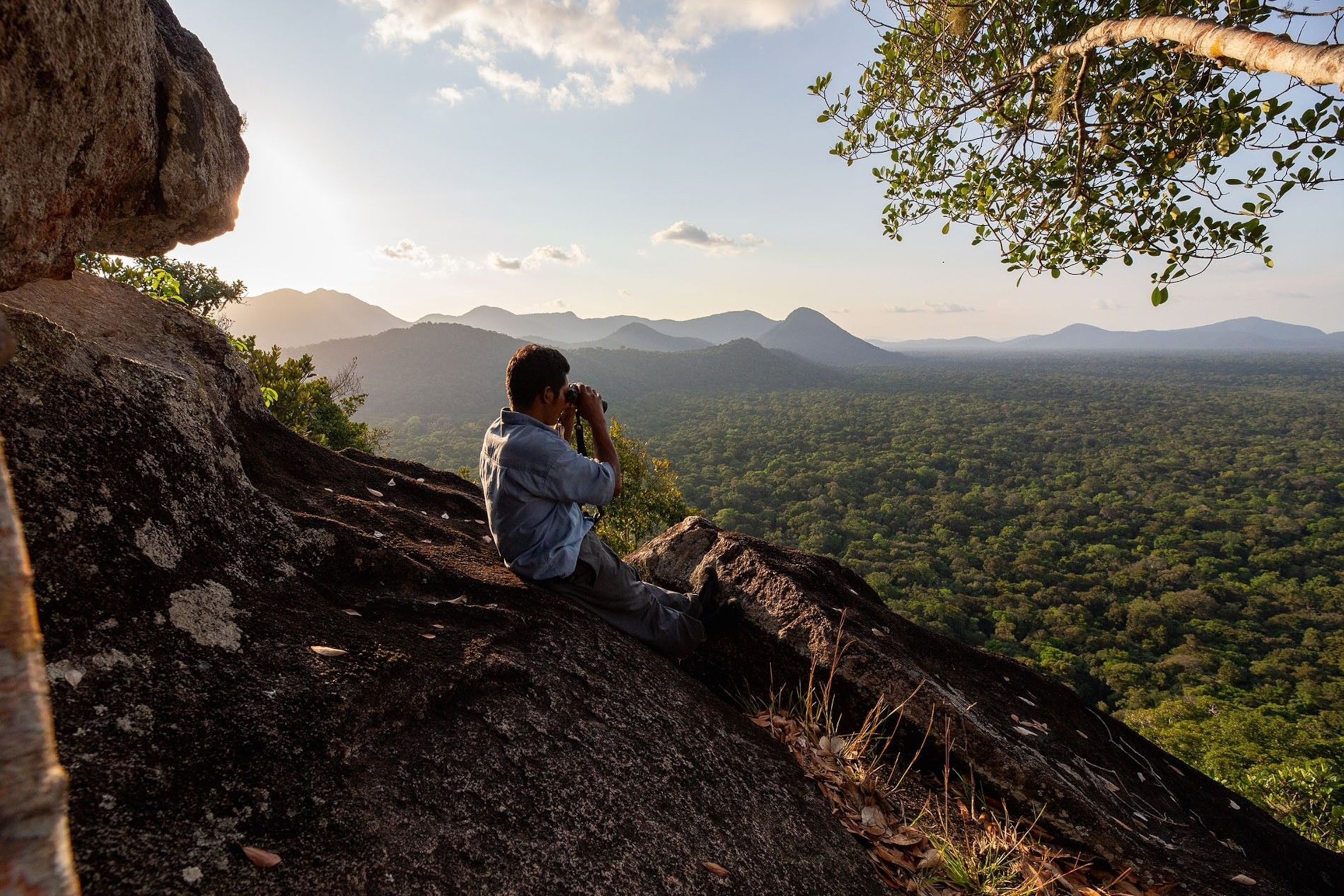 Local guide Vivian looks out across the Rewa basin. For those living this remotely, the Rewa and Essequibo Rivers are vital transport networks — essential highways through the untamed jungle.