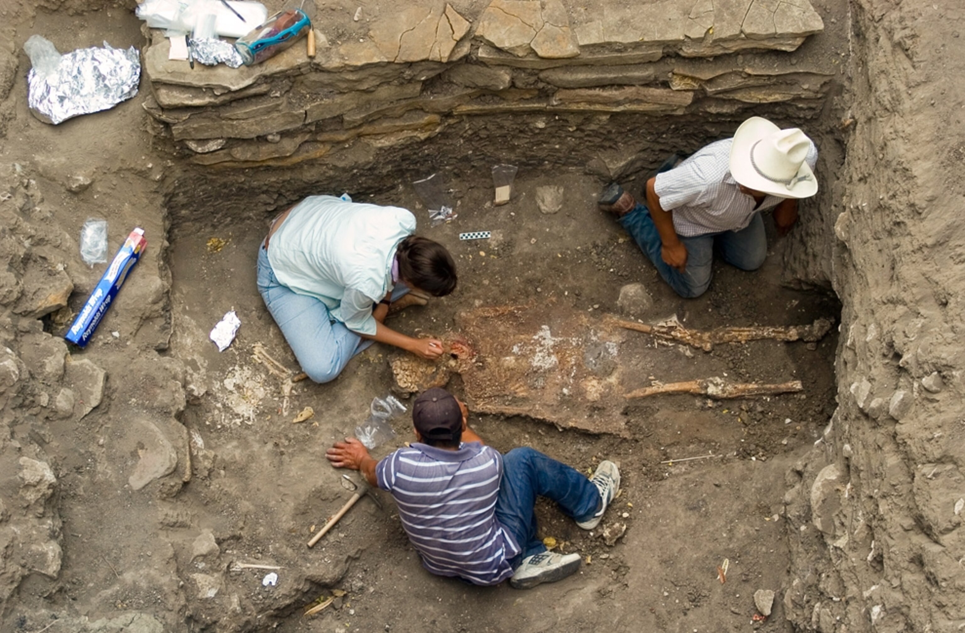 A picture of archaeologists excavating the oldest known pyramid tomb in Mesoamerica.