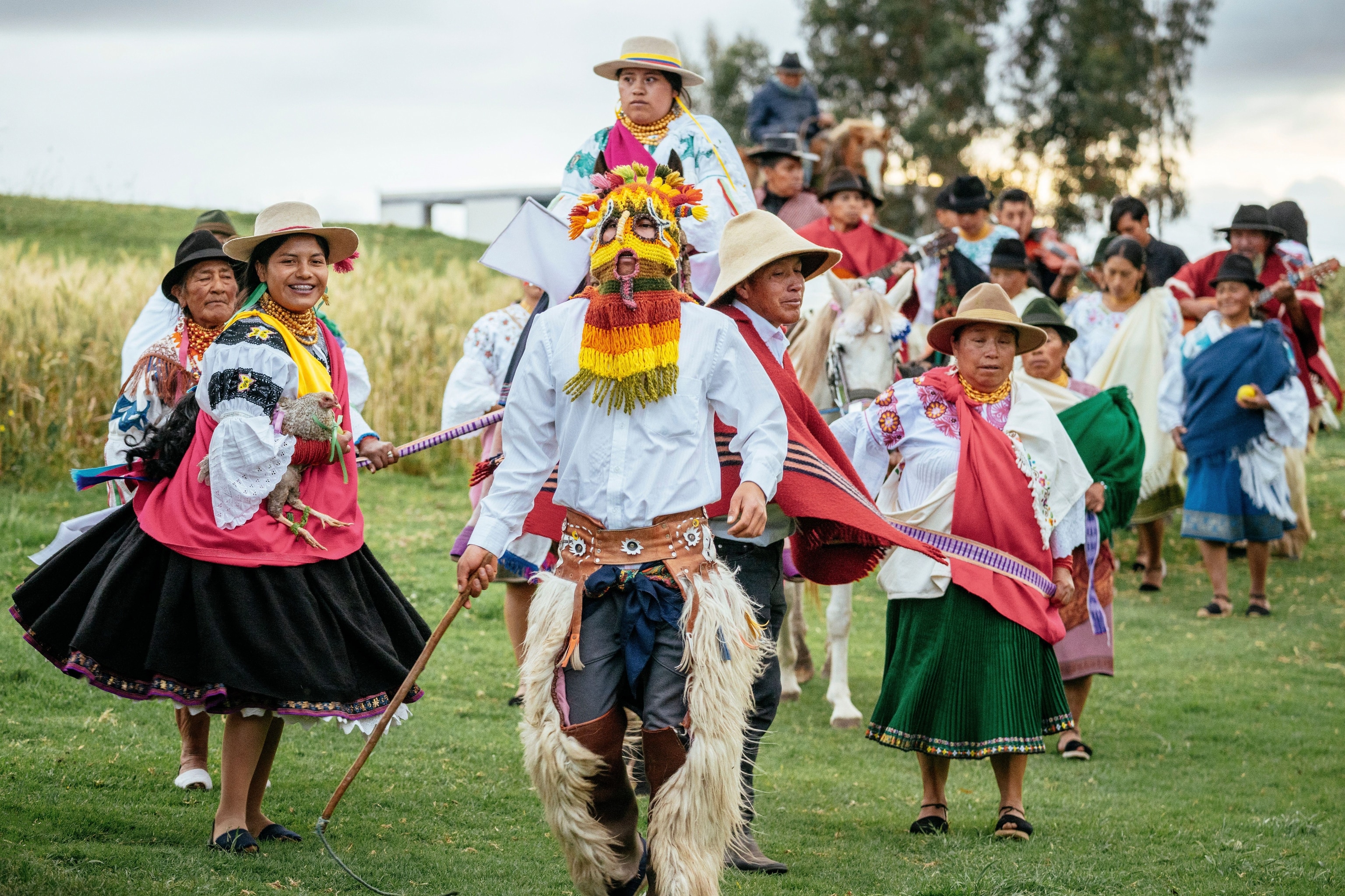 Dancers in costumes in a town square