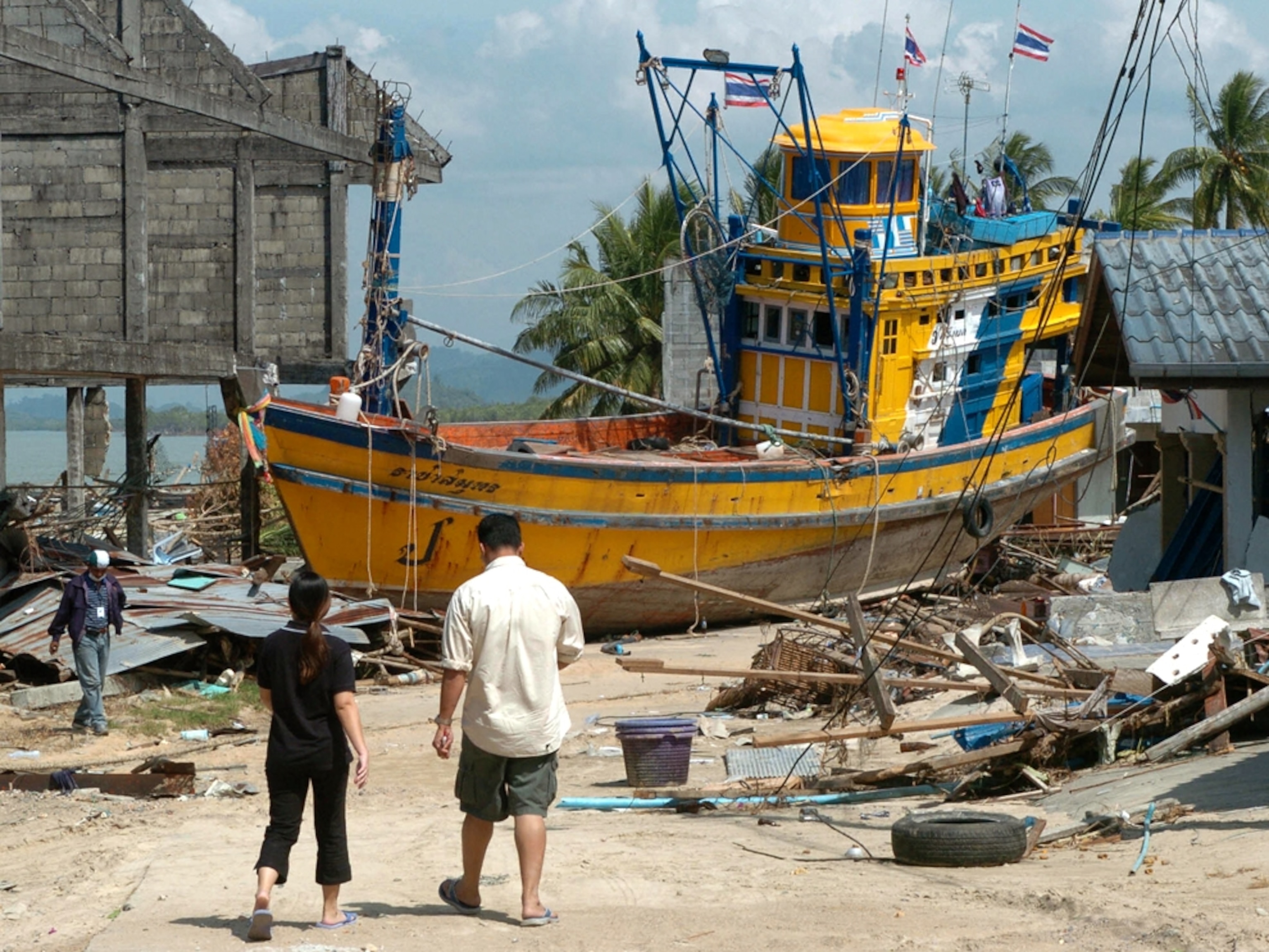 Fishing boat rests on a street after Thailand tsunami