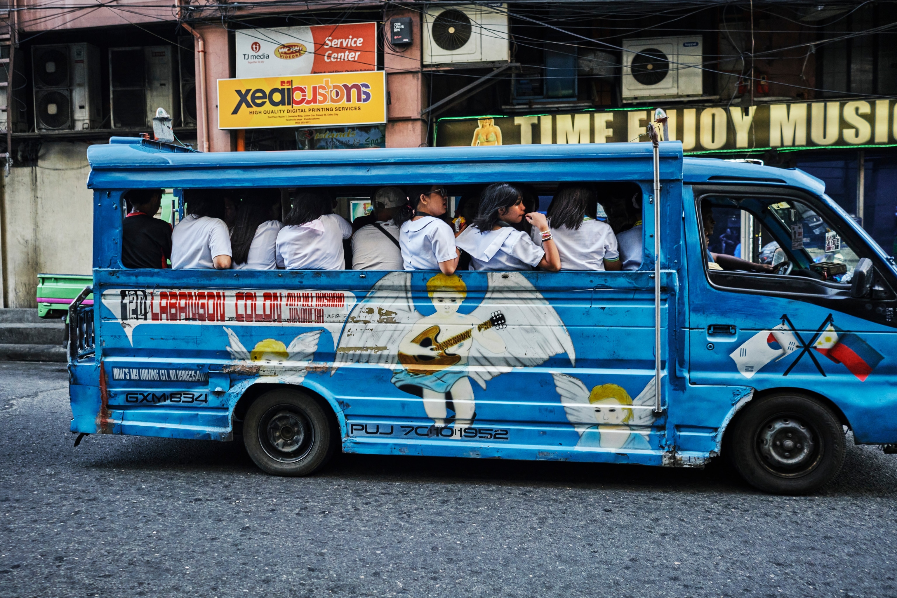 A jeepney shuttles commuters through the streets of Cebu, Philippines, in July 2025. The country's popular mode of transportation emerged decades ago when American troops left Willys Jeeps behind at the end of World War II. Today, slightly bigger buses have replaced those jeeps, and their drivers are known to be quite aggressive in order to make their way through the city's busy streets.