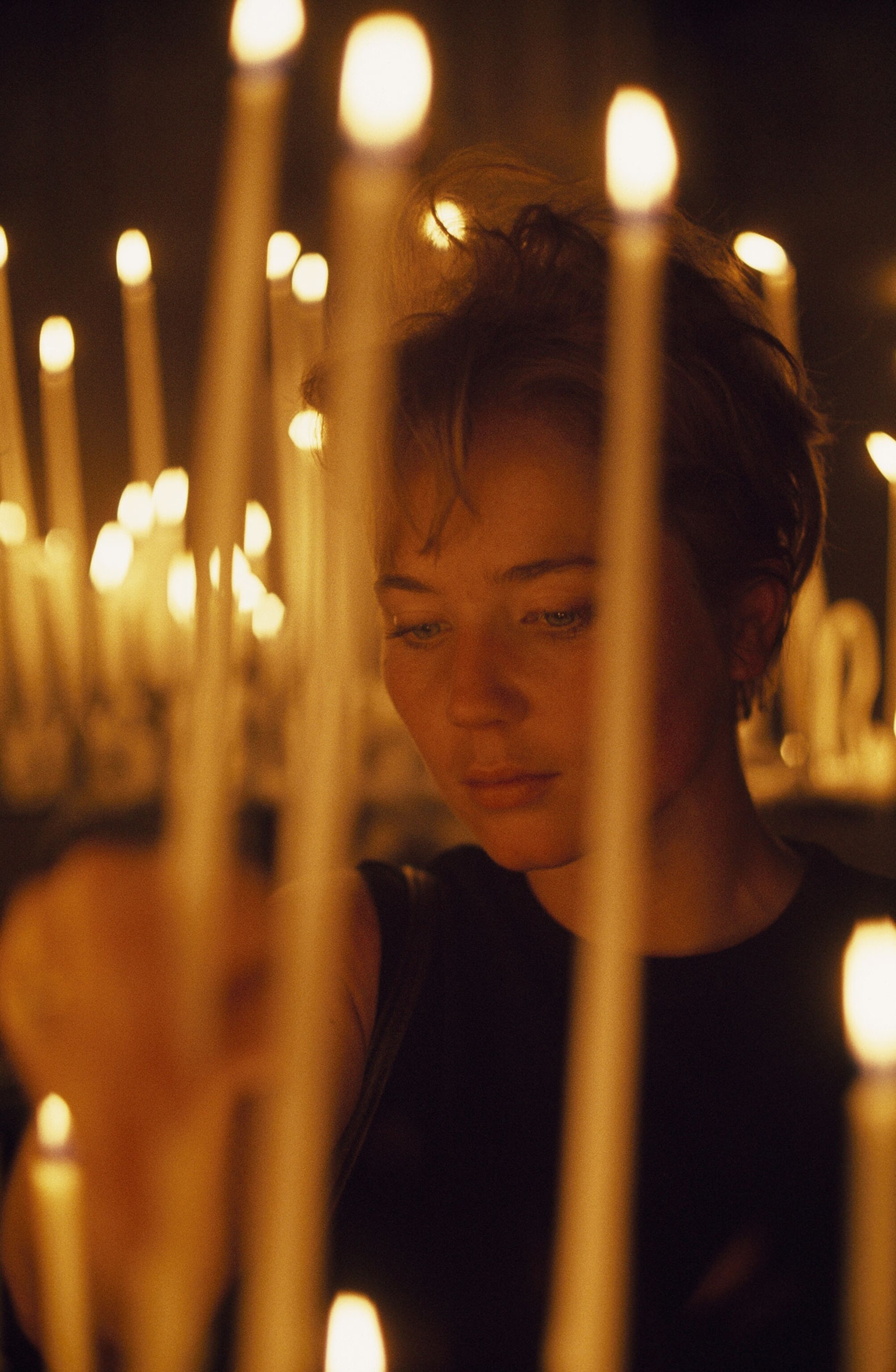 a woman among candles