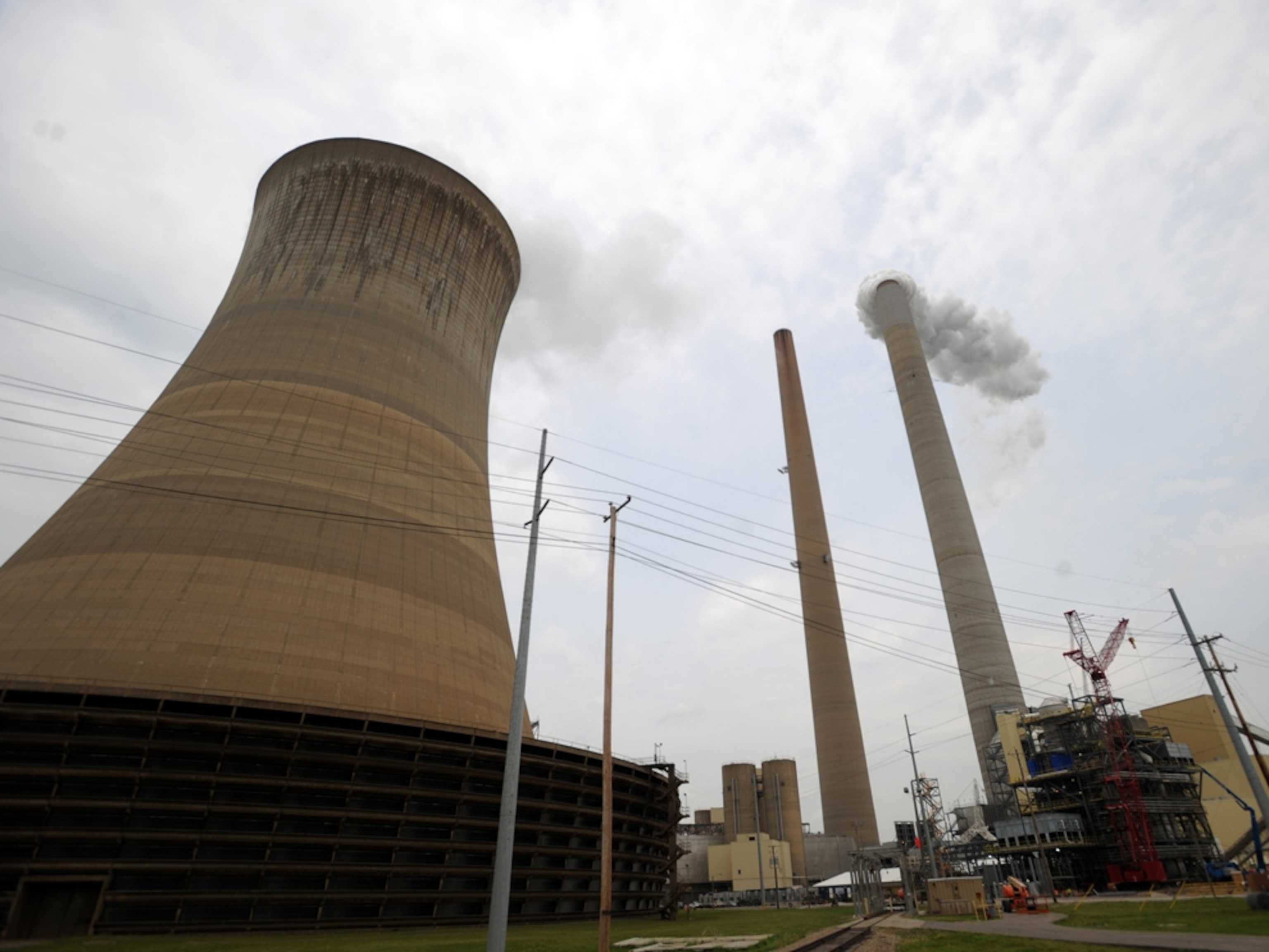 In this April 30, 2009 photo, a carbon dioxide capture system is seen under construction at American Electric Power's Mountaineer Plant in New Haven, W.Va. Power company American Electric Power said Thursday, Oct. 29, 2009, that its third quarter earnings rose 18 percent as rate increases and cost cutting offset weak demand for electricity from industrial customers.(AP Photo/Jeff Gentner)