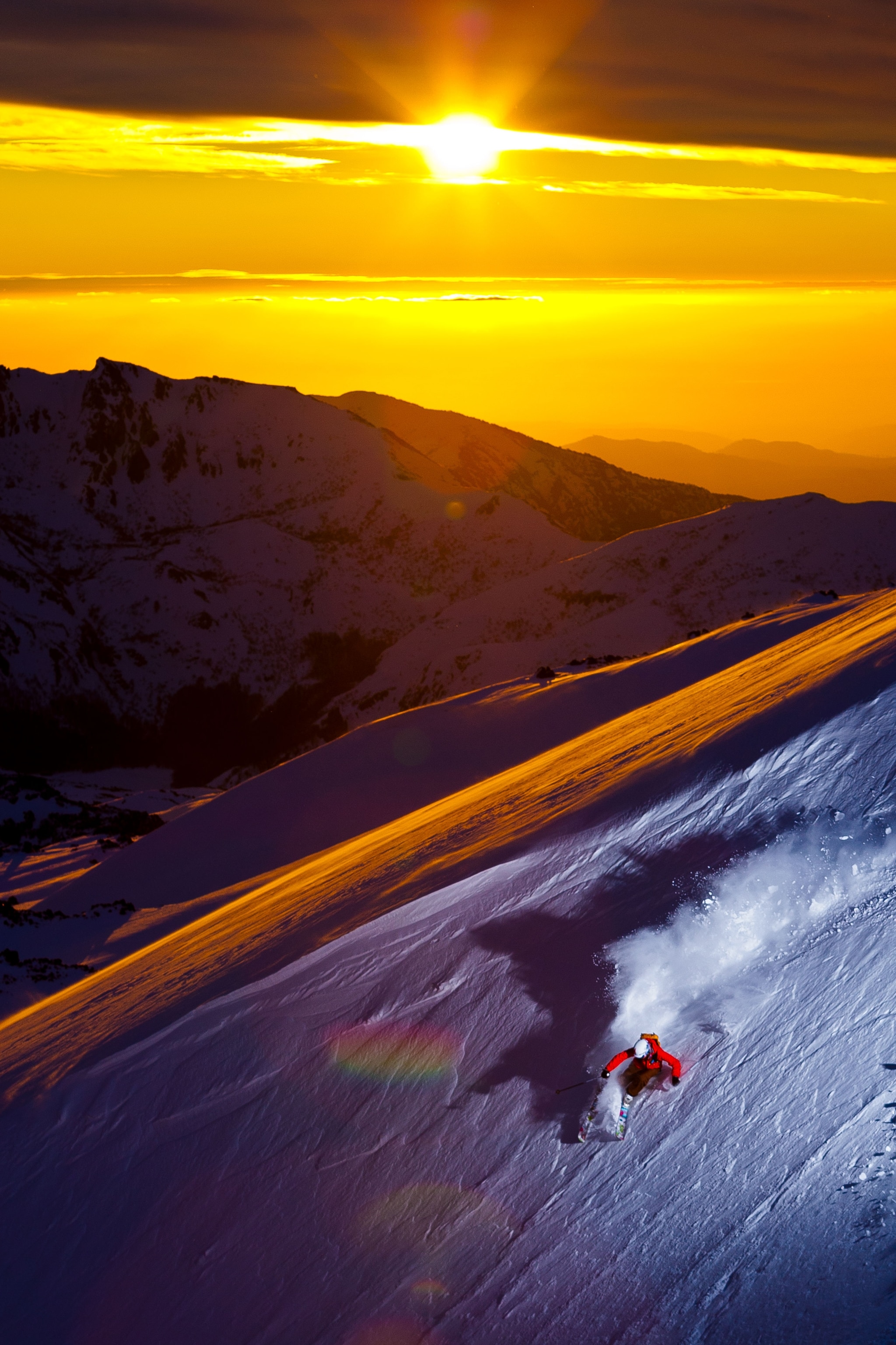 a skier at sunset