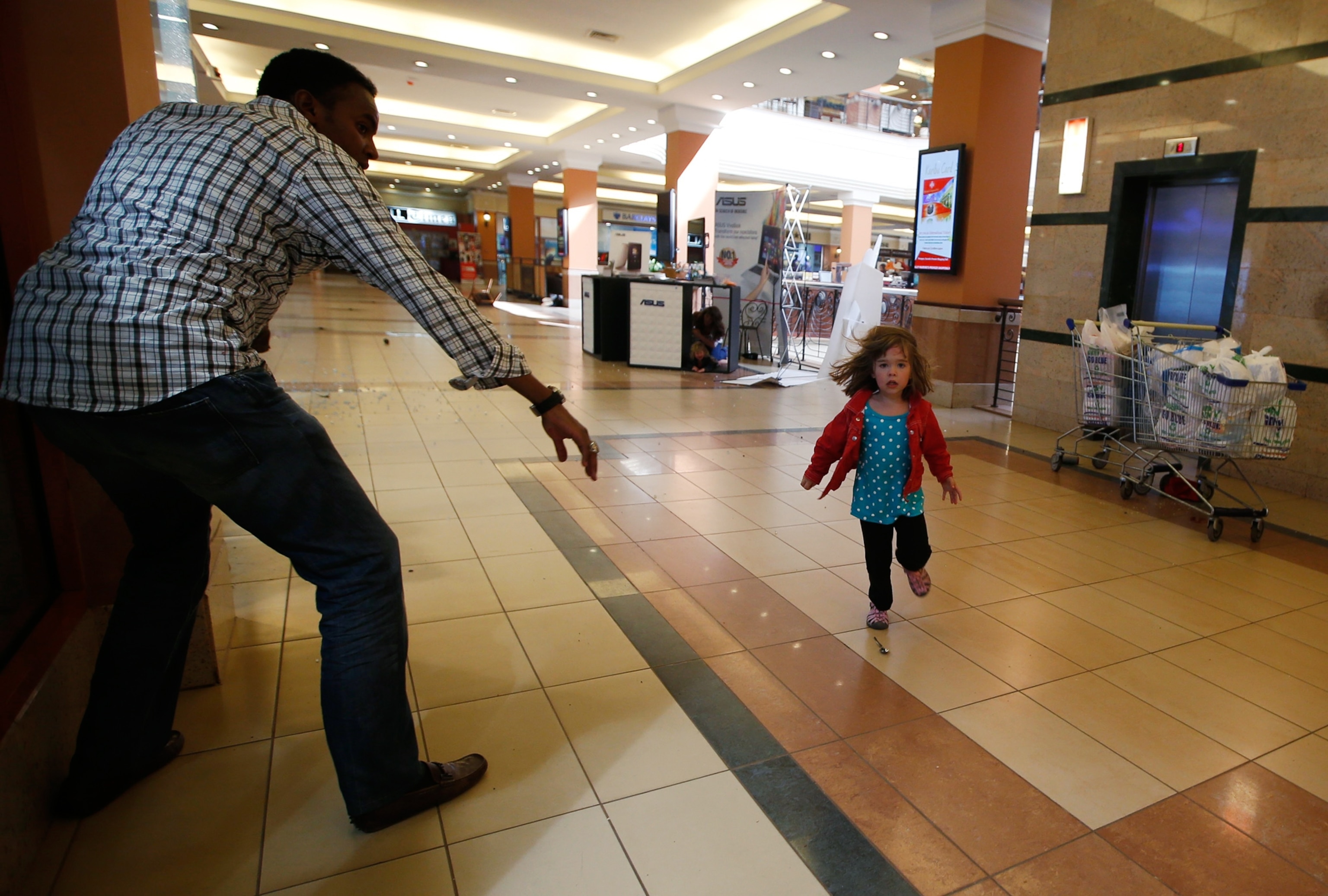 Pictures We Love - Picture of a child running for safety during the gunfire attack at a Nairobi shopping mall