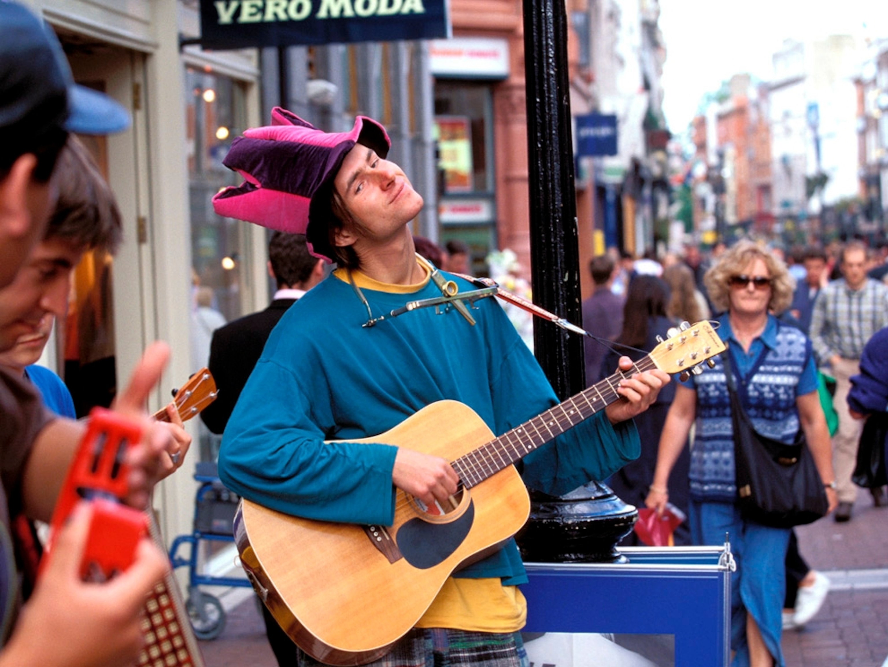 Busker playing guitar