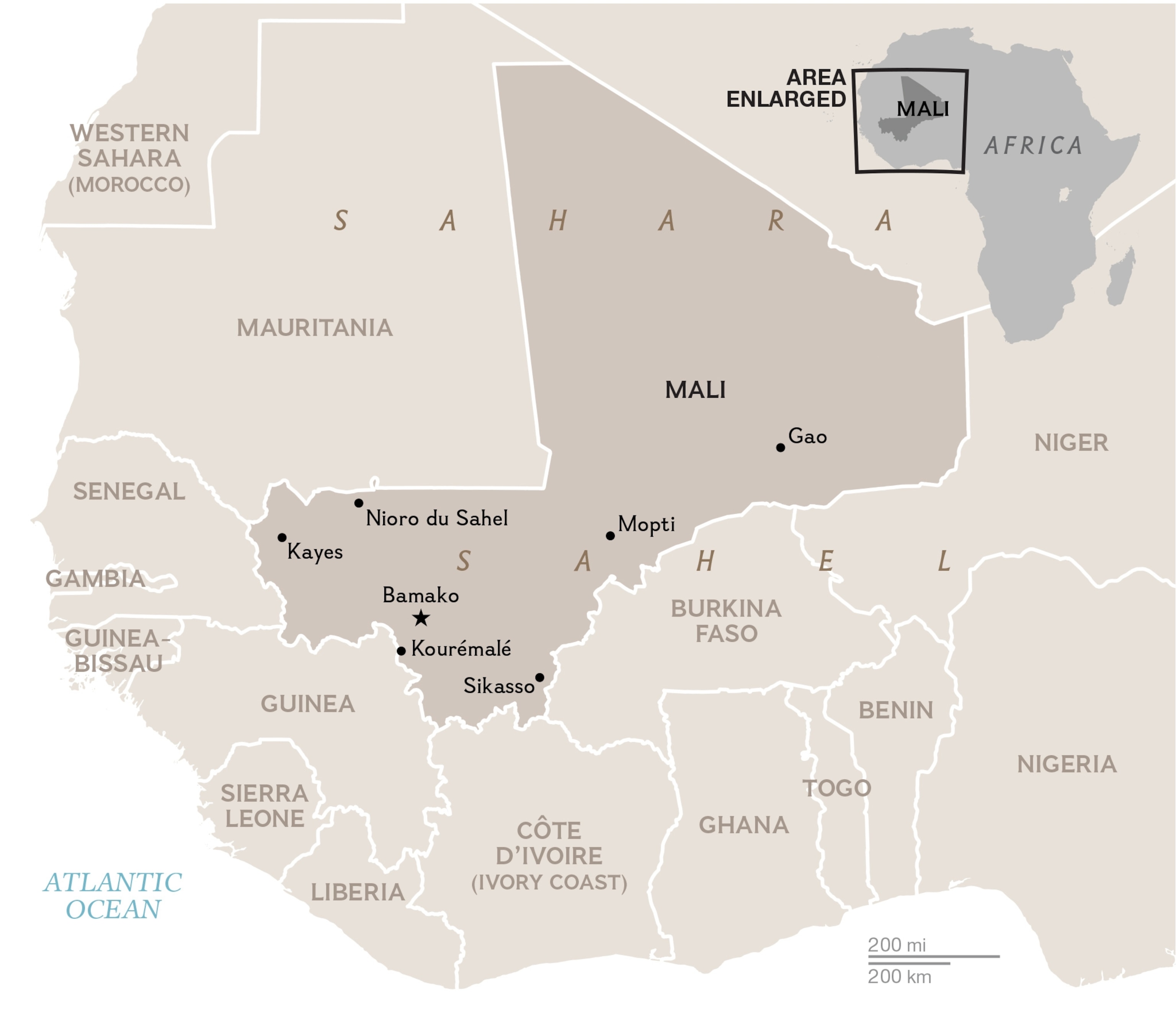 Children watch as health workers spray disinfectants at a mosque in Bamako November 14, 2014.