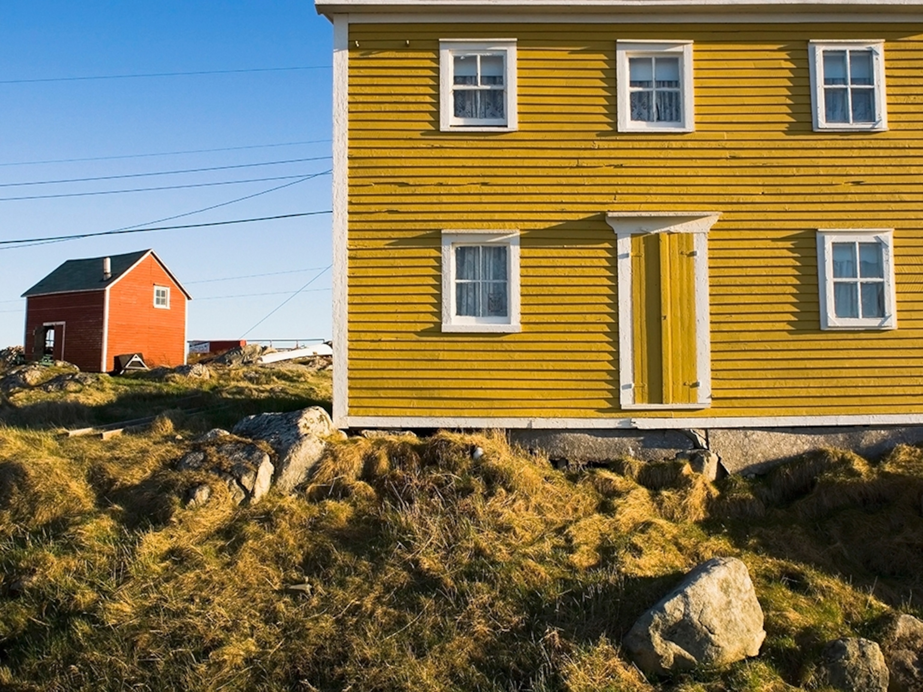 a yellow house in Fogo Island, Newfoundland