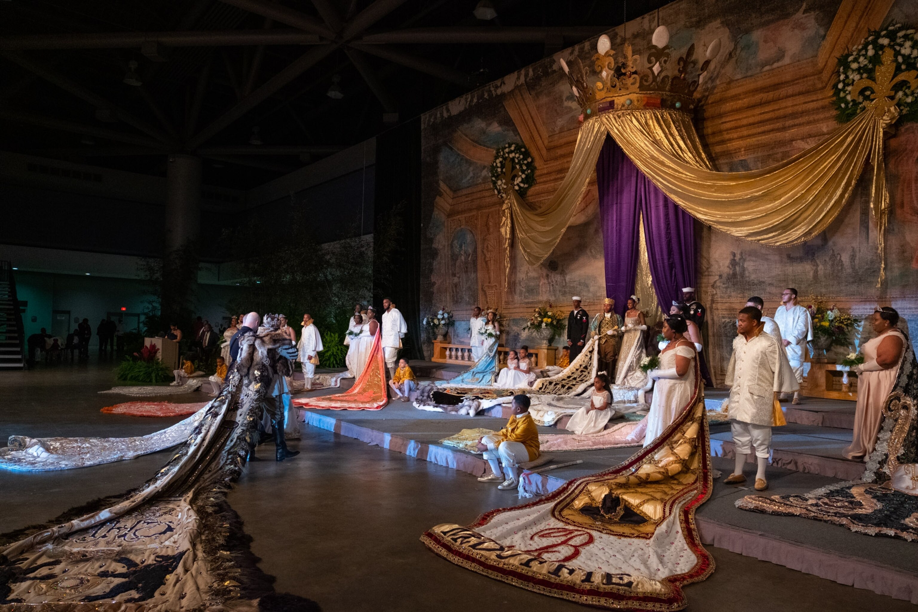 people dressed in royal attire meeting on an altar