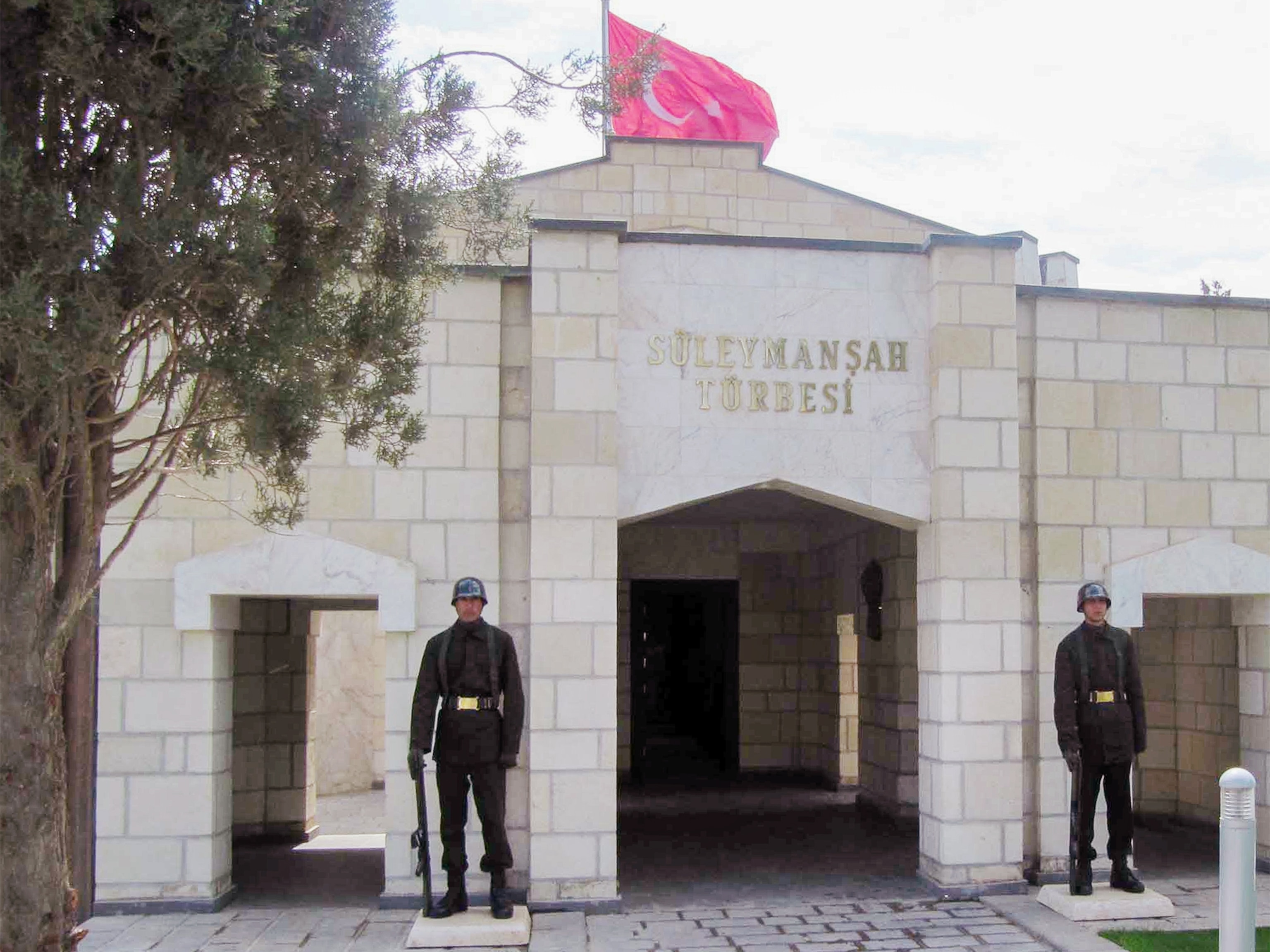 Turkish soldiers standing guard at the site of Suleyman Shah tomb in Syria.