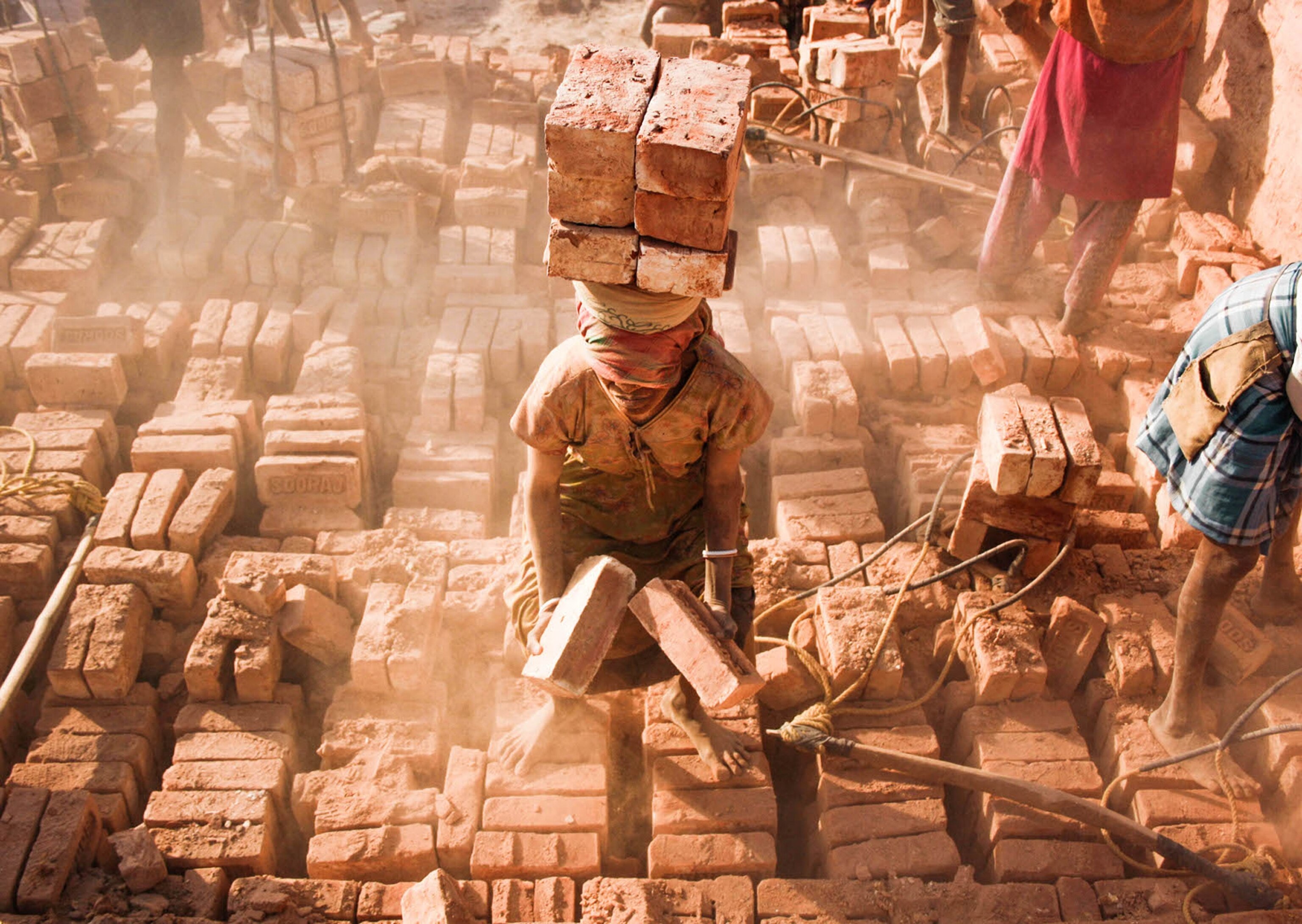 a woman working in the brick fields of West Bengal, India