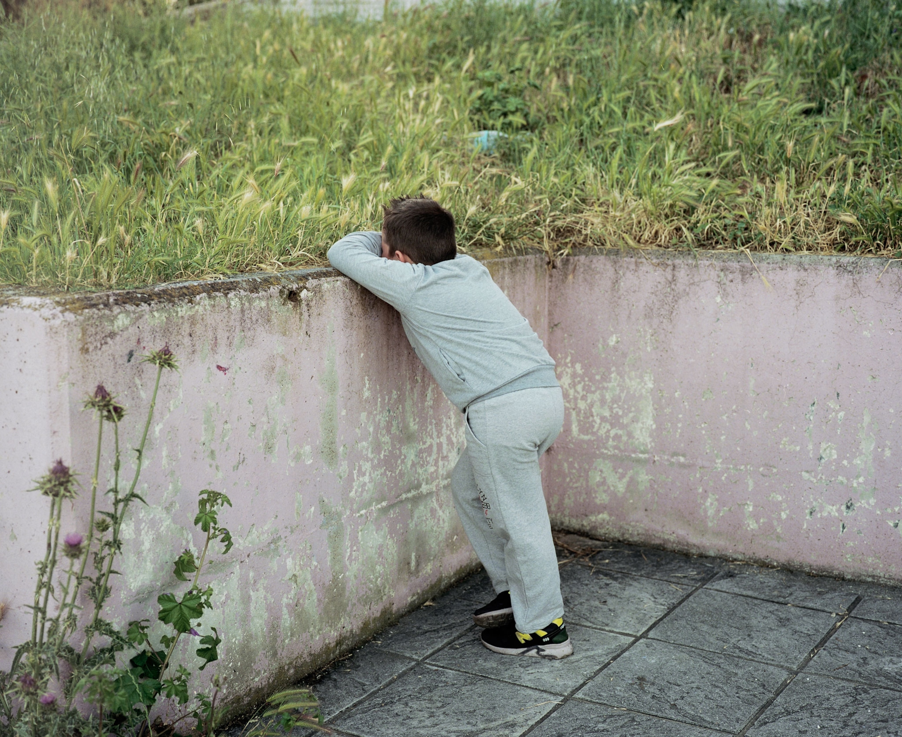 a young boy crying in Greece