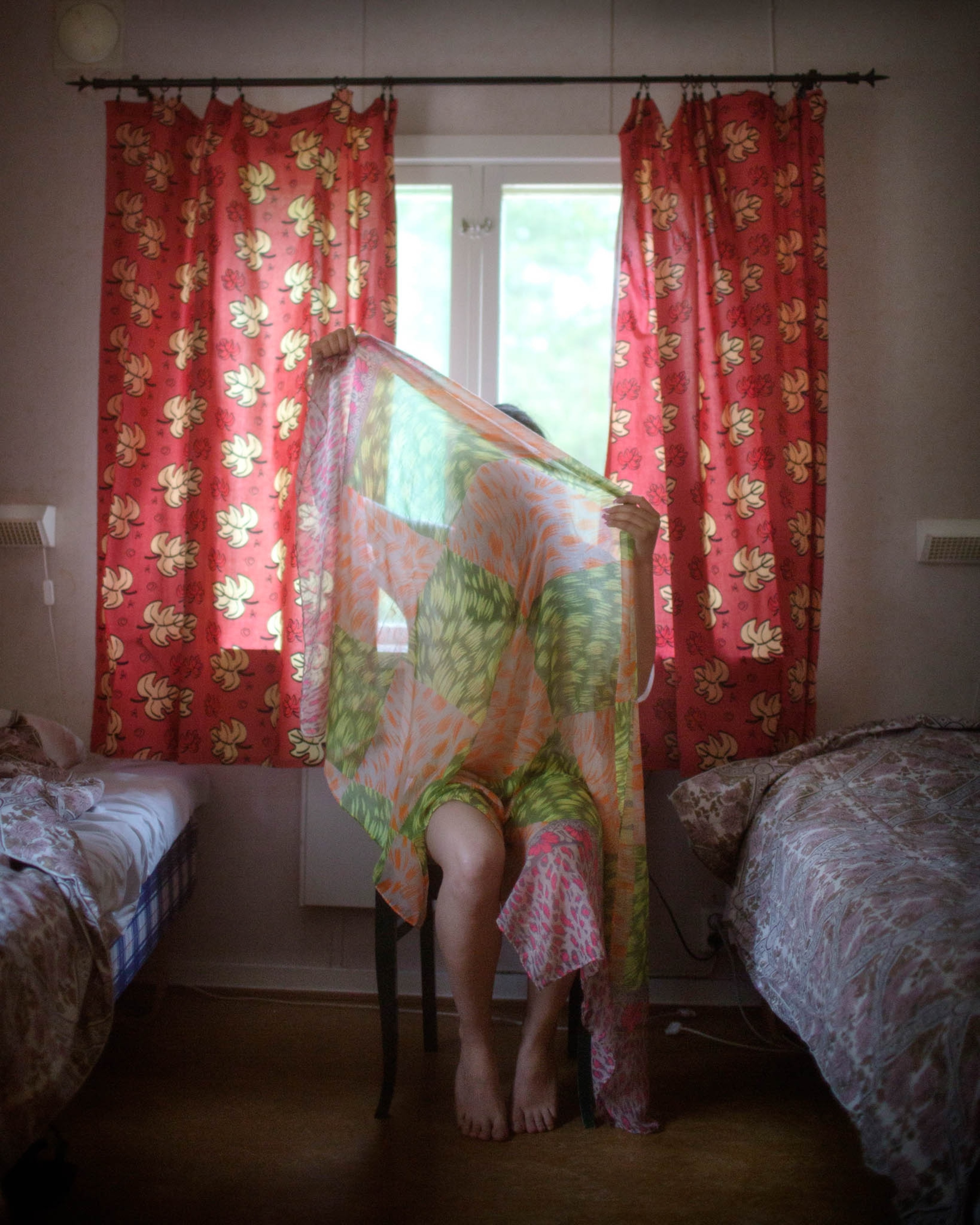 woman obscuring face with veil