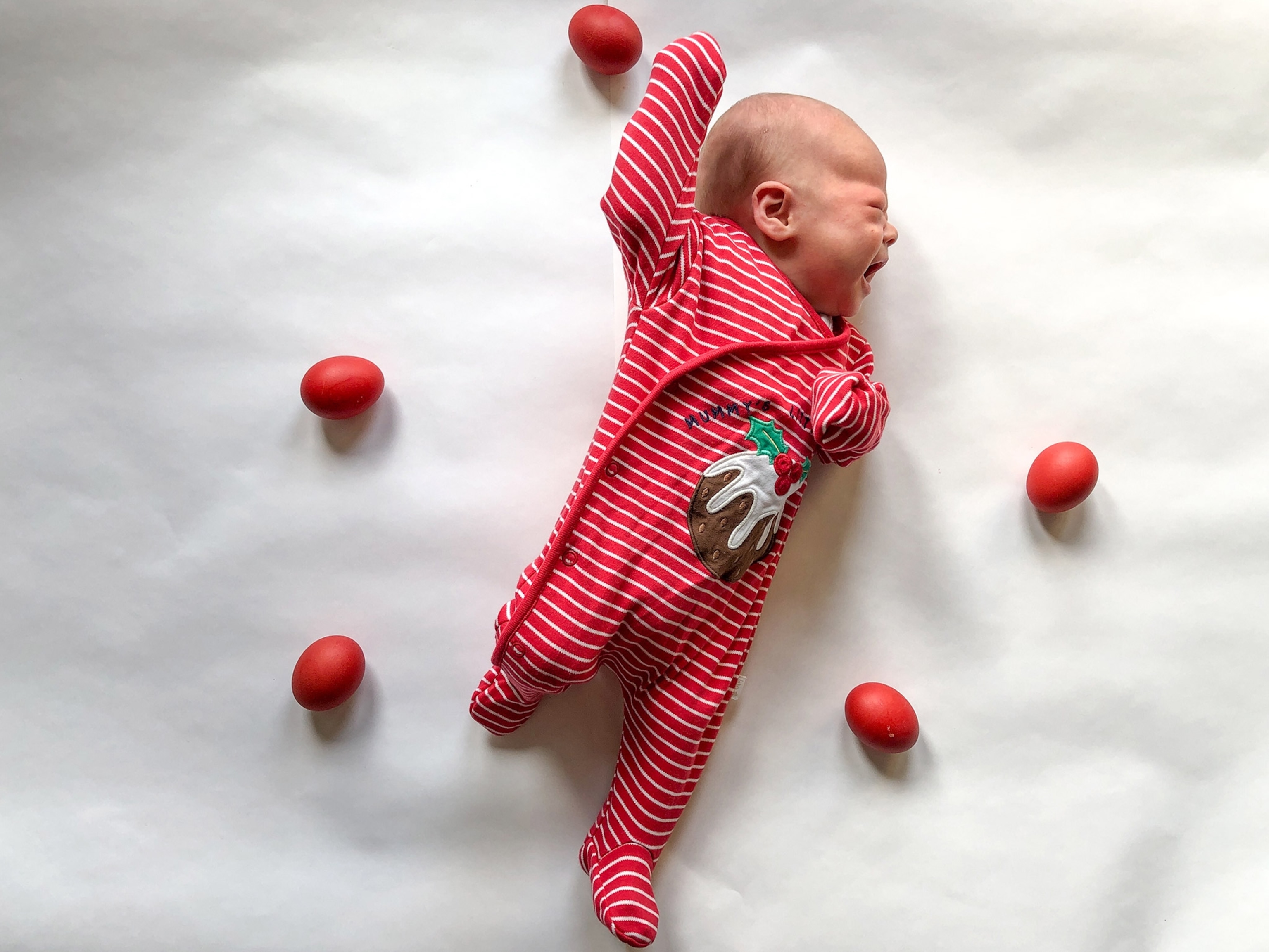 a baby dressed in red