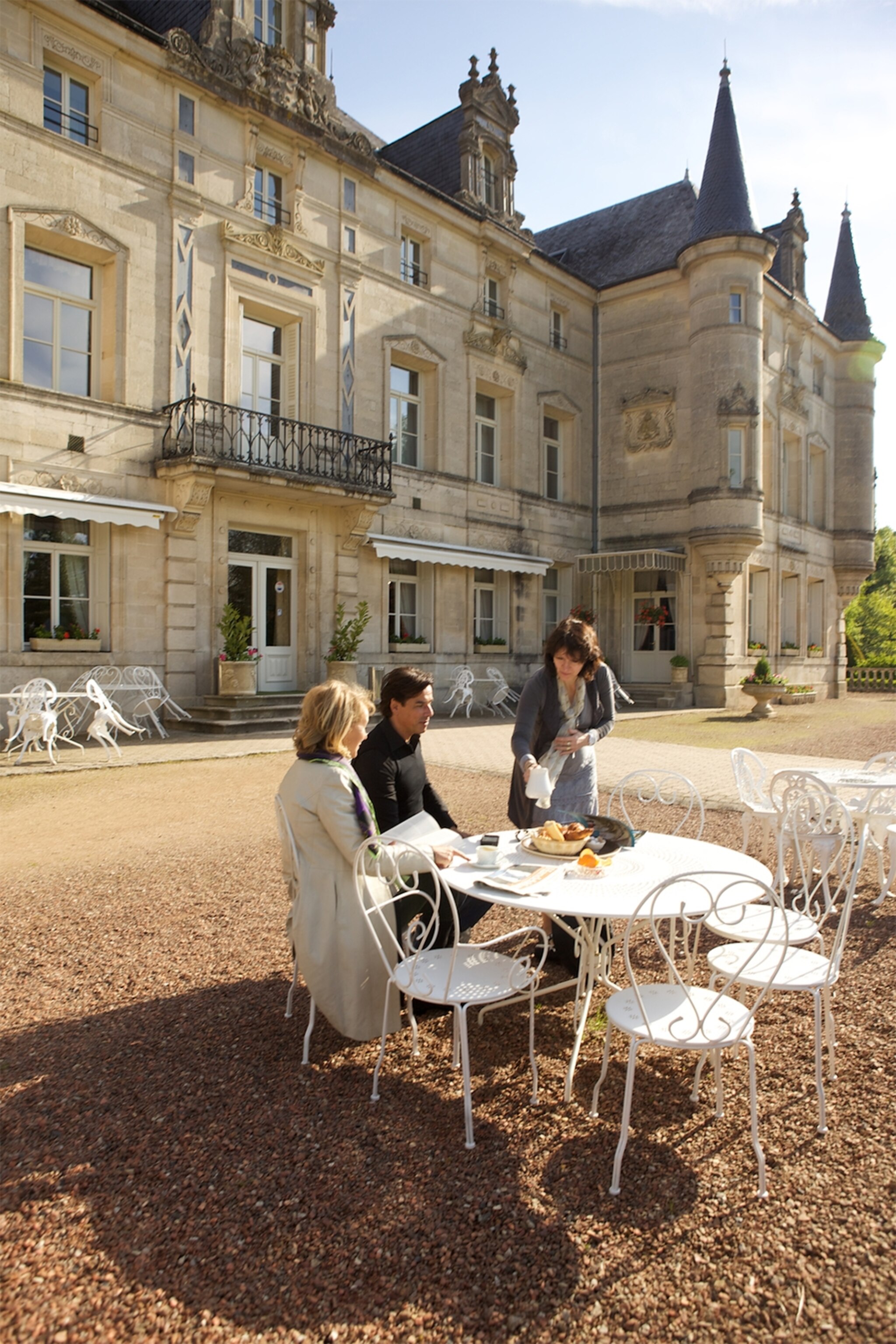 a couple eating breakfast at Chateau des Monthairons in France