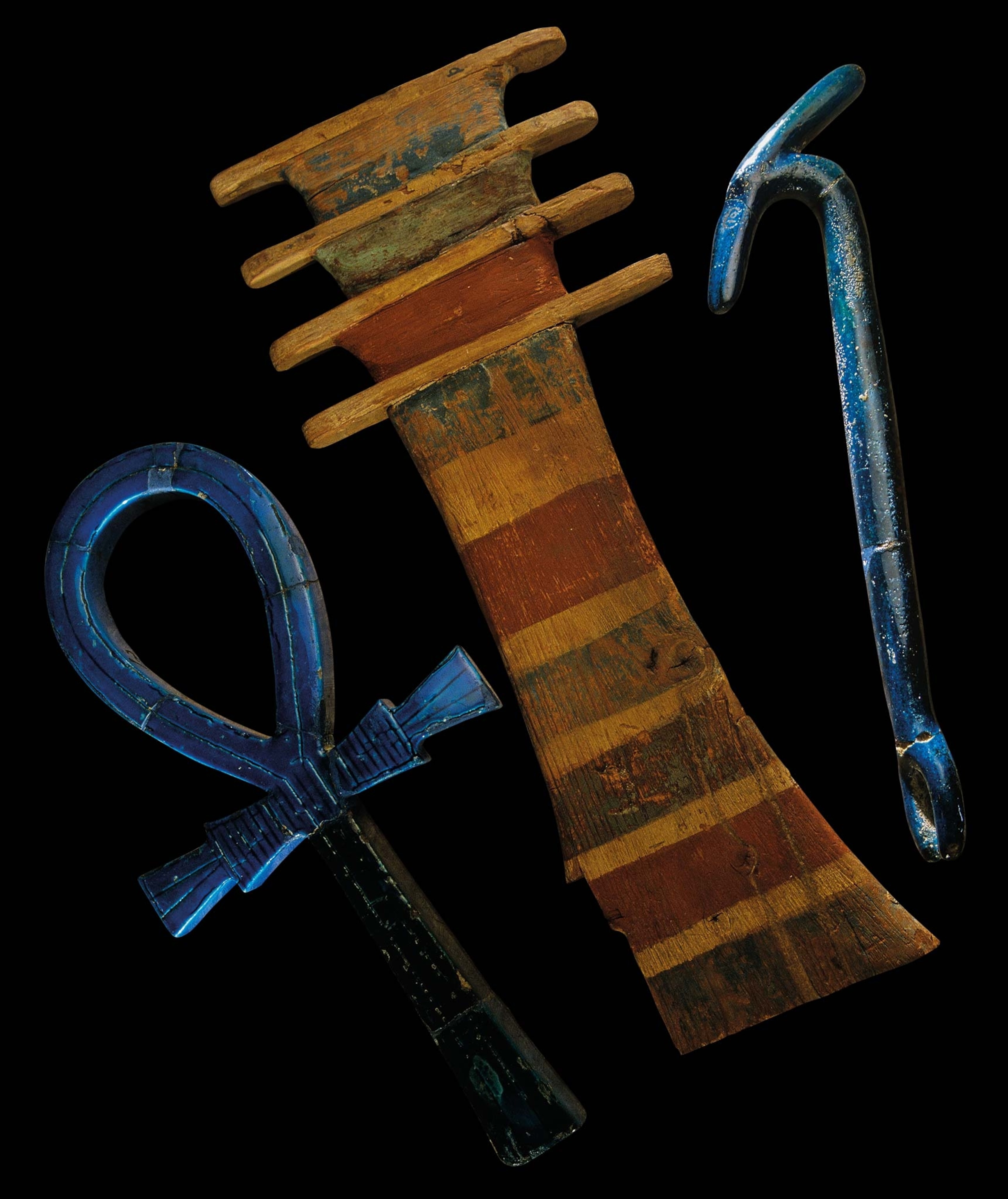 Several amulets like these were found in the pharaoh’s tomb: the ankh symbol, the djed pillar, and the was scepter.
