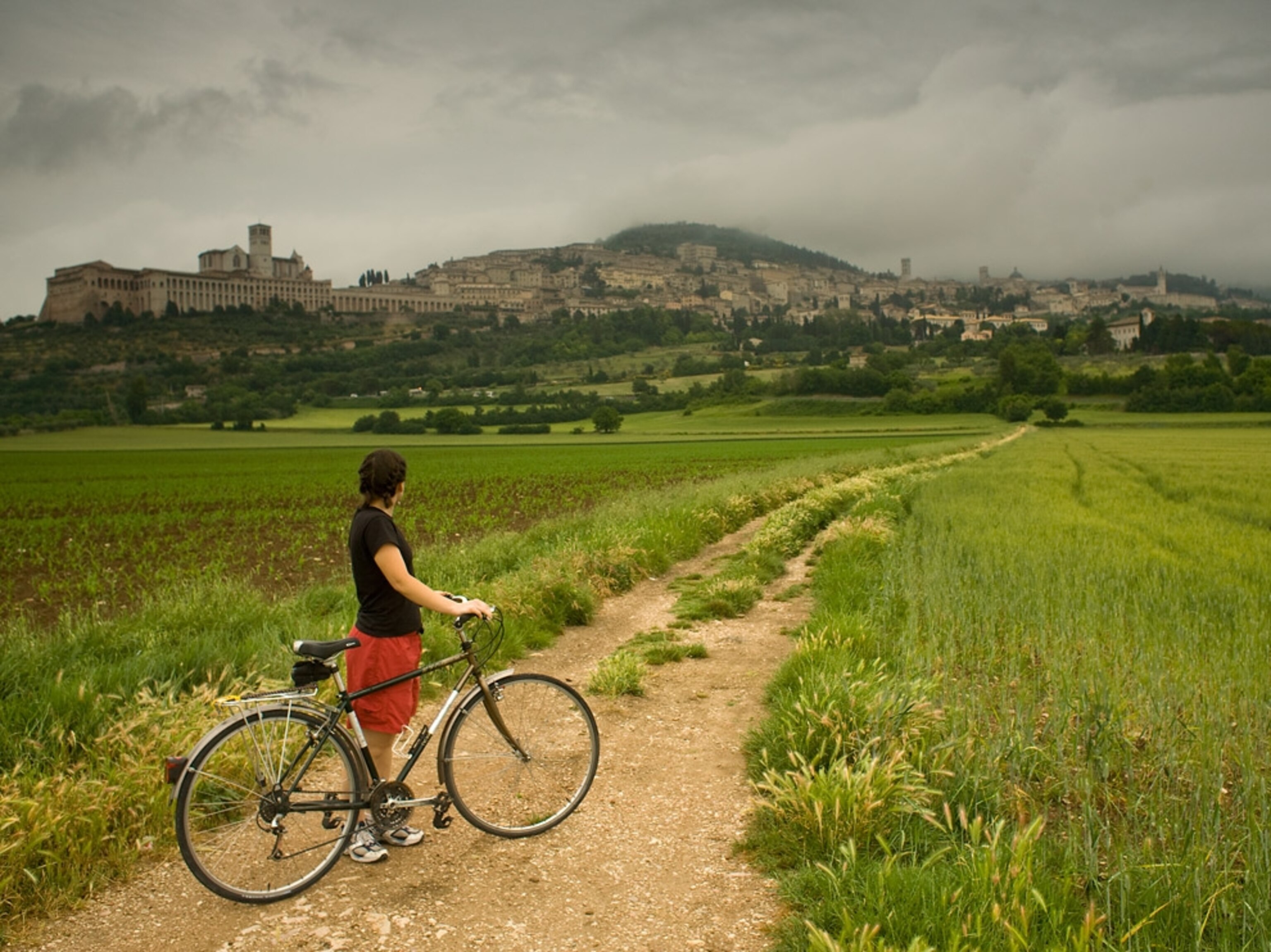 A woman biking in Italy