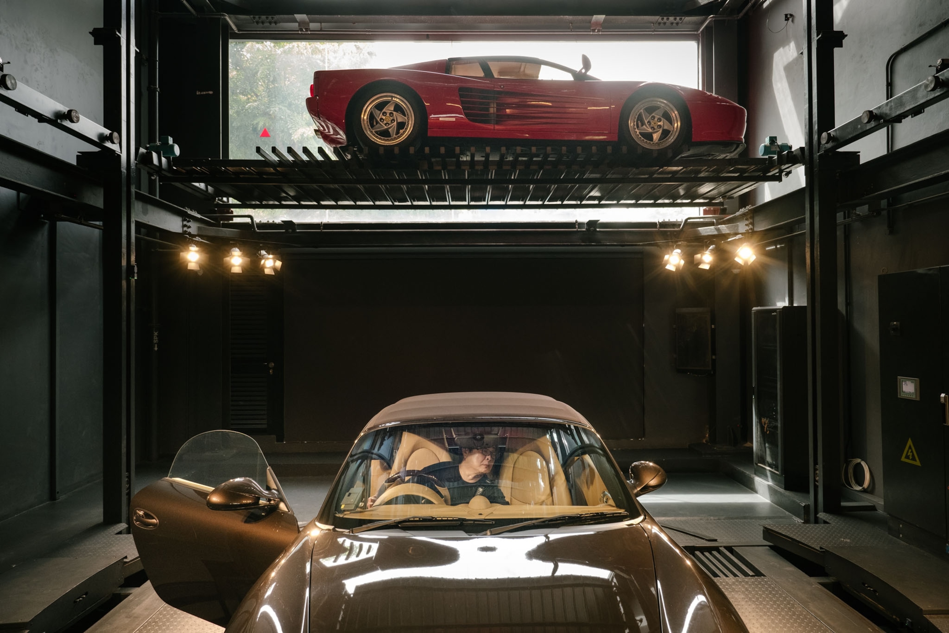 man inspecting Porsche Boxster S that he later bought for his 21-year-old son, Singapore.