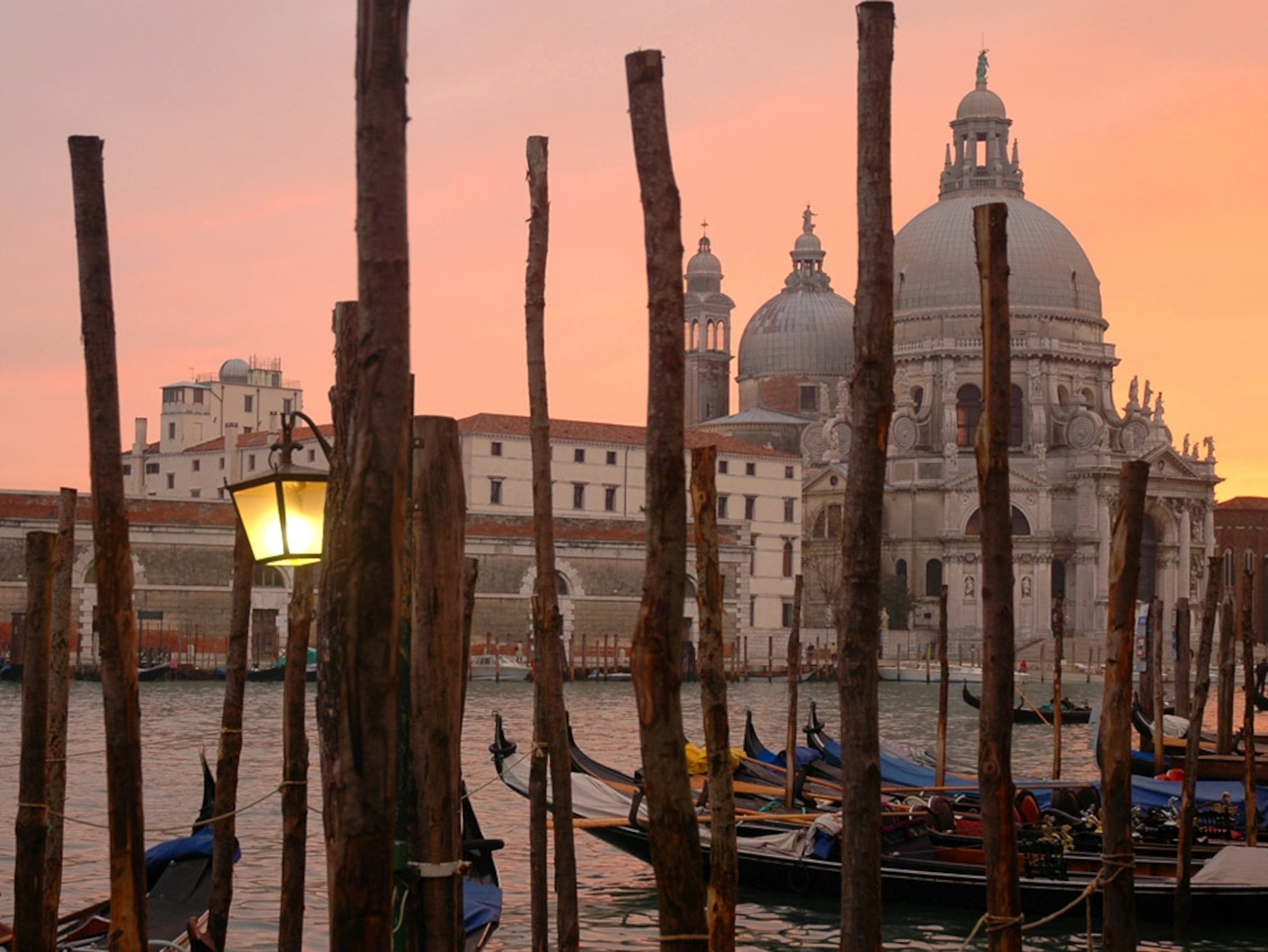 Sun setting behind a Venetian cathedral