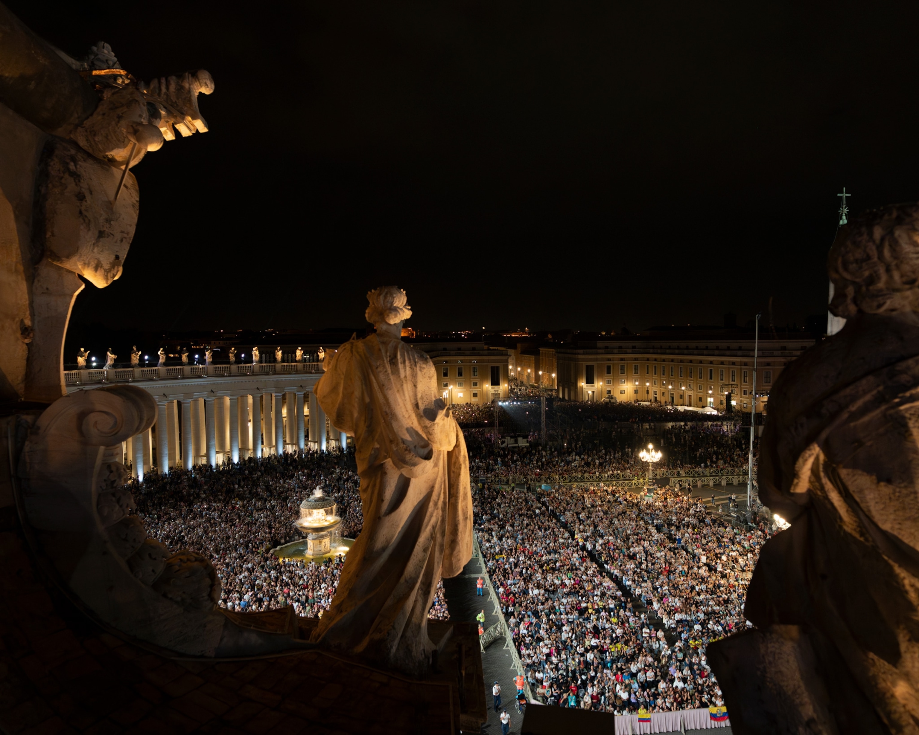 crowd of people at night in vatican square