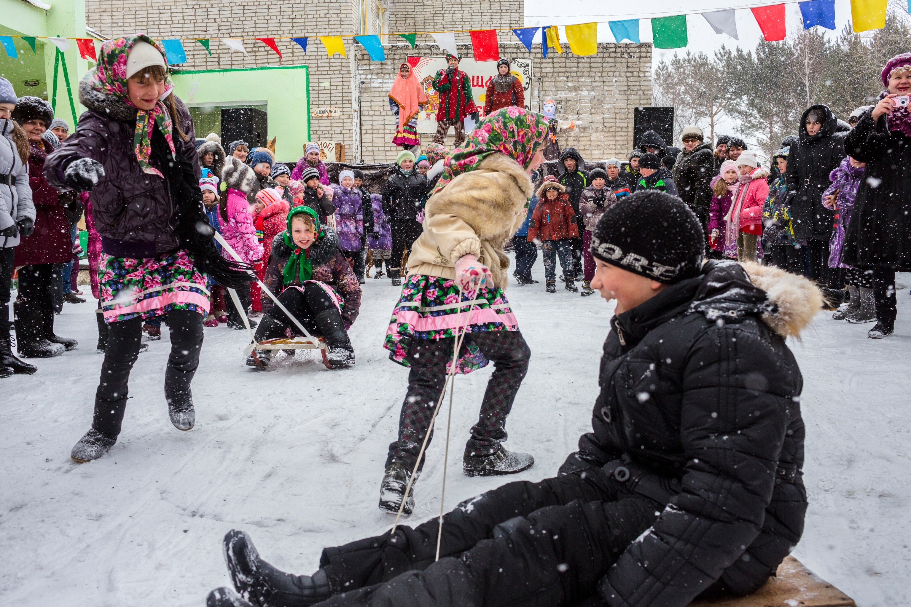 Children enjoy Maslenitsa, a traditional Eastern Slavic event to celebrate the end of winter, in Siberia, Russia. The religious and folk holiday dates back to pagan times. However, it now has ties to Christianity and occurs the week before Russian Orthodox Lent.