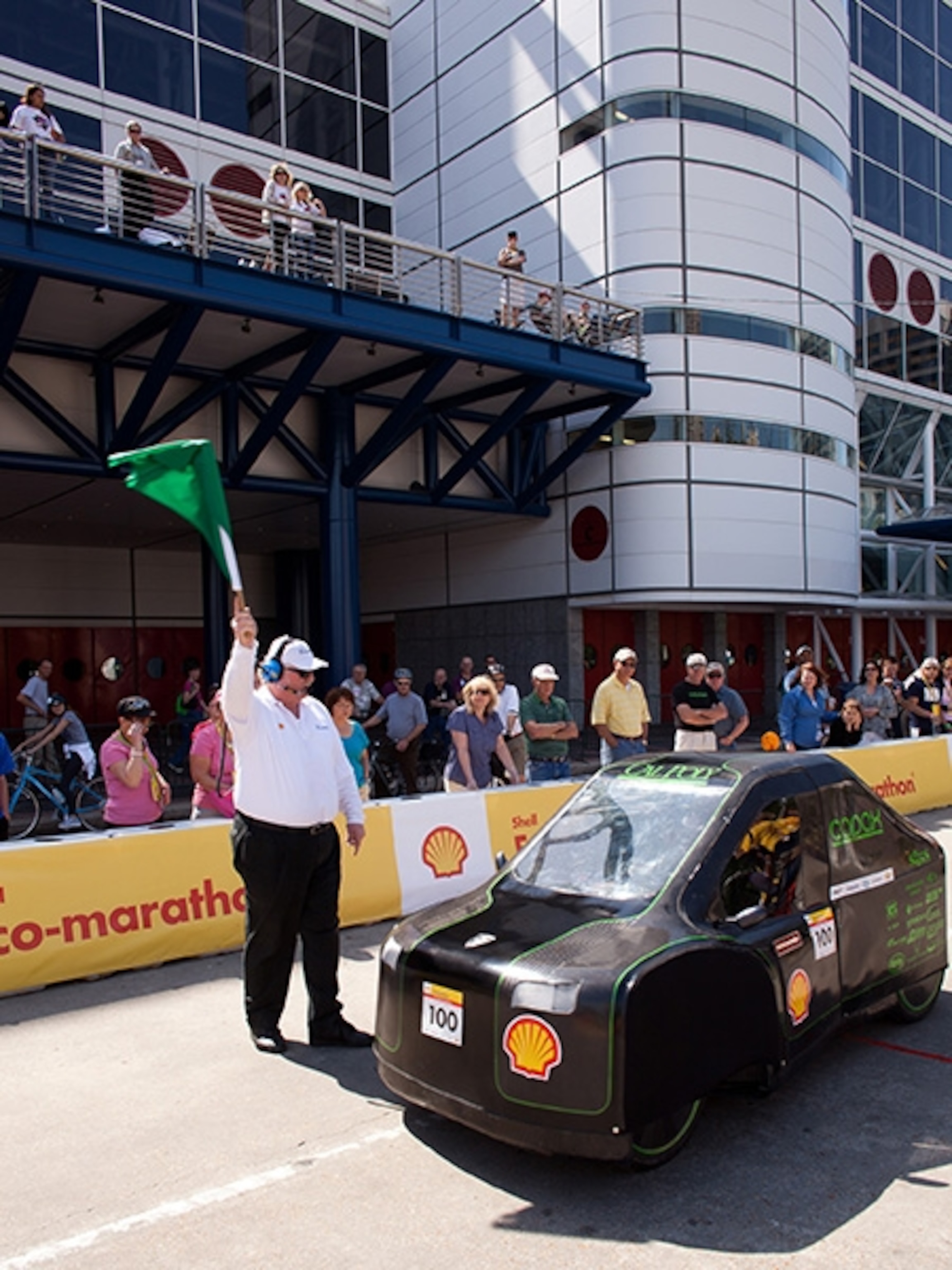 The Urban Concept car from Cal Poly gets the green start flag on their first run at the Eco-Marathon. The gasoline powered car was the early leader in their division.