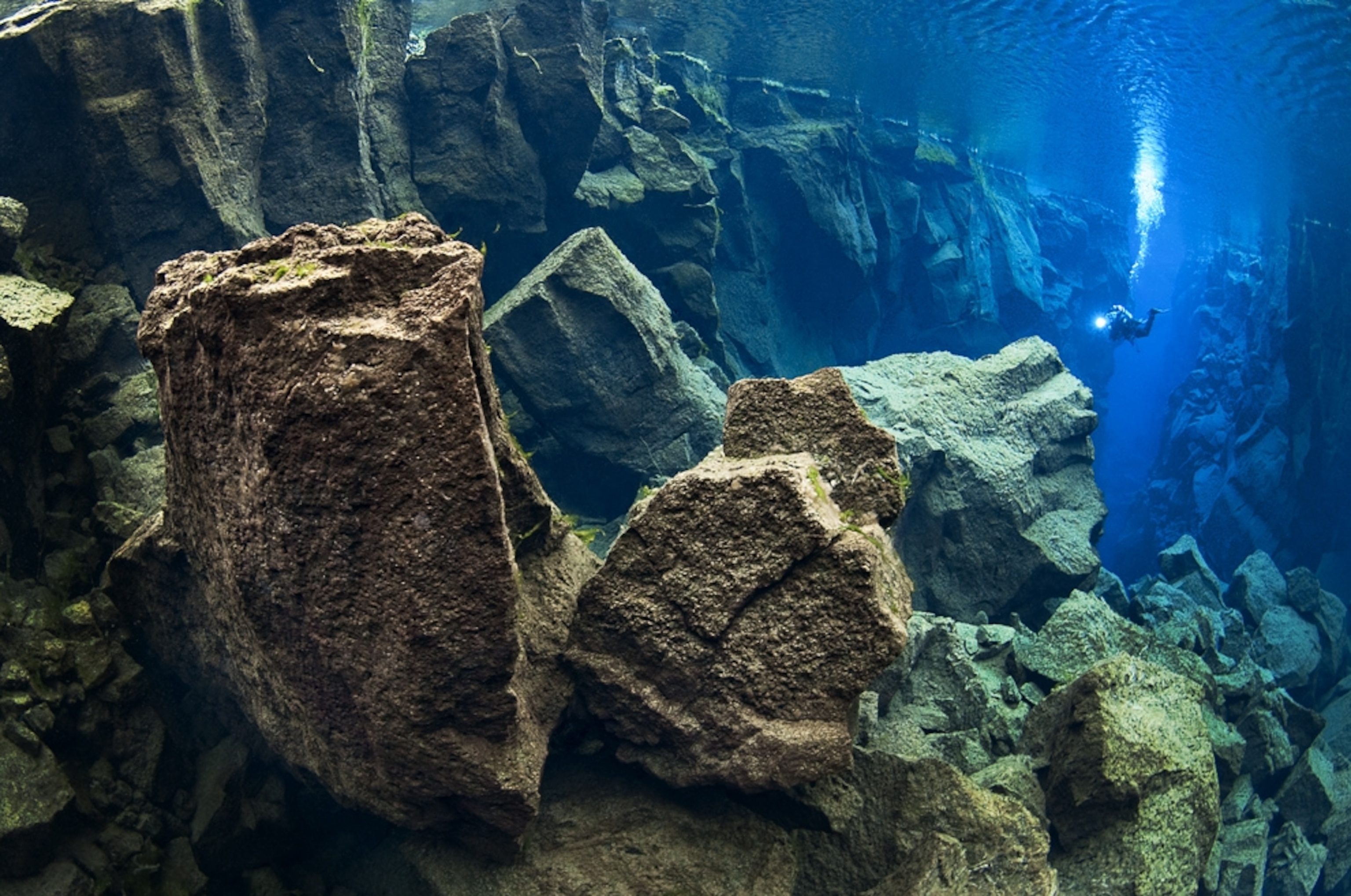 A diver exploring a continental trench in Silfra, Iceland, one of the award-winning pictures in the fourth annual Deep Indonesia International Underwater Photo Competition