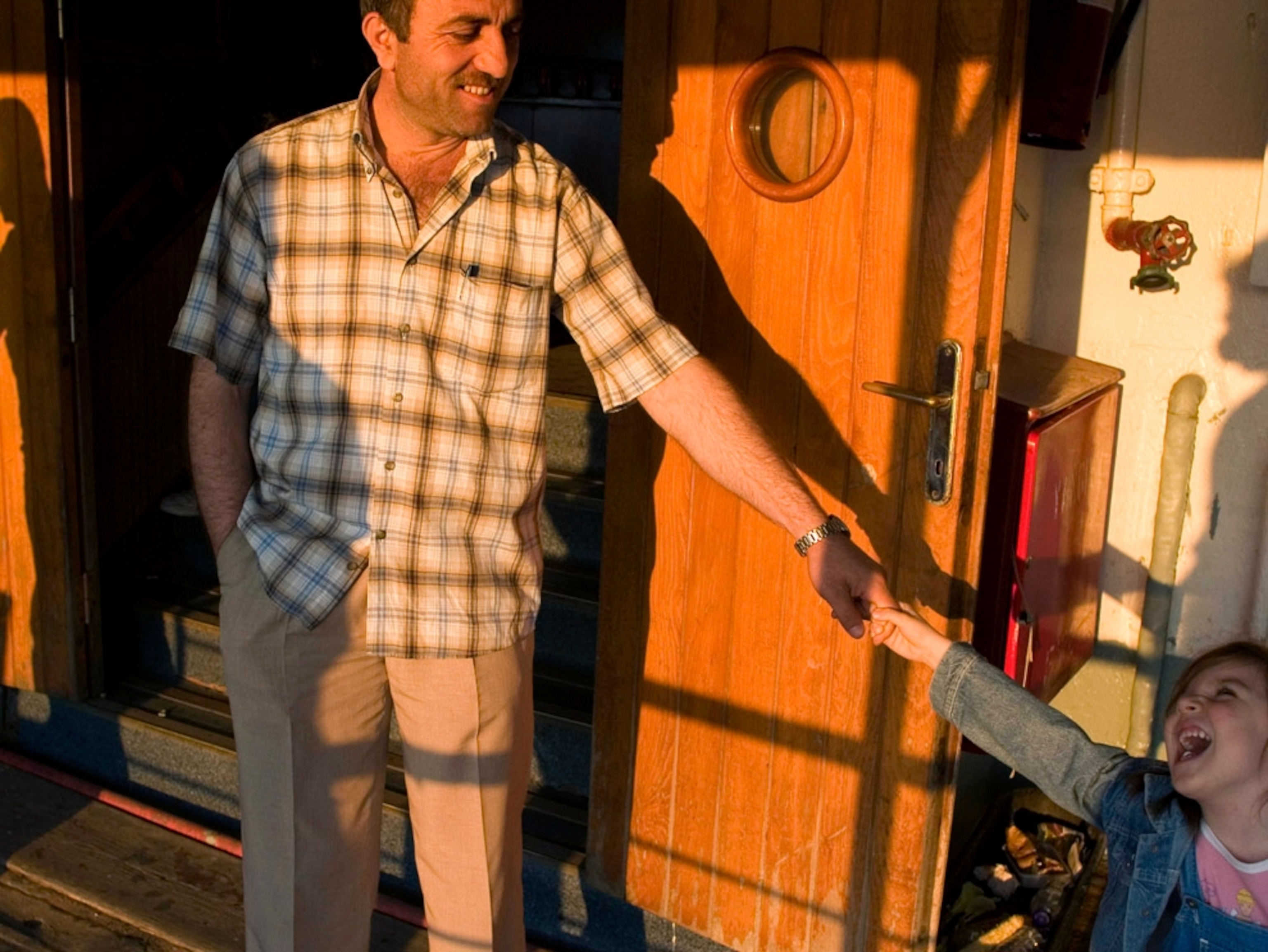 Grandfather and grandchild on a ferry