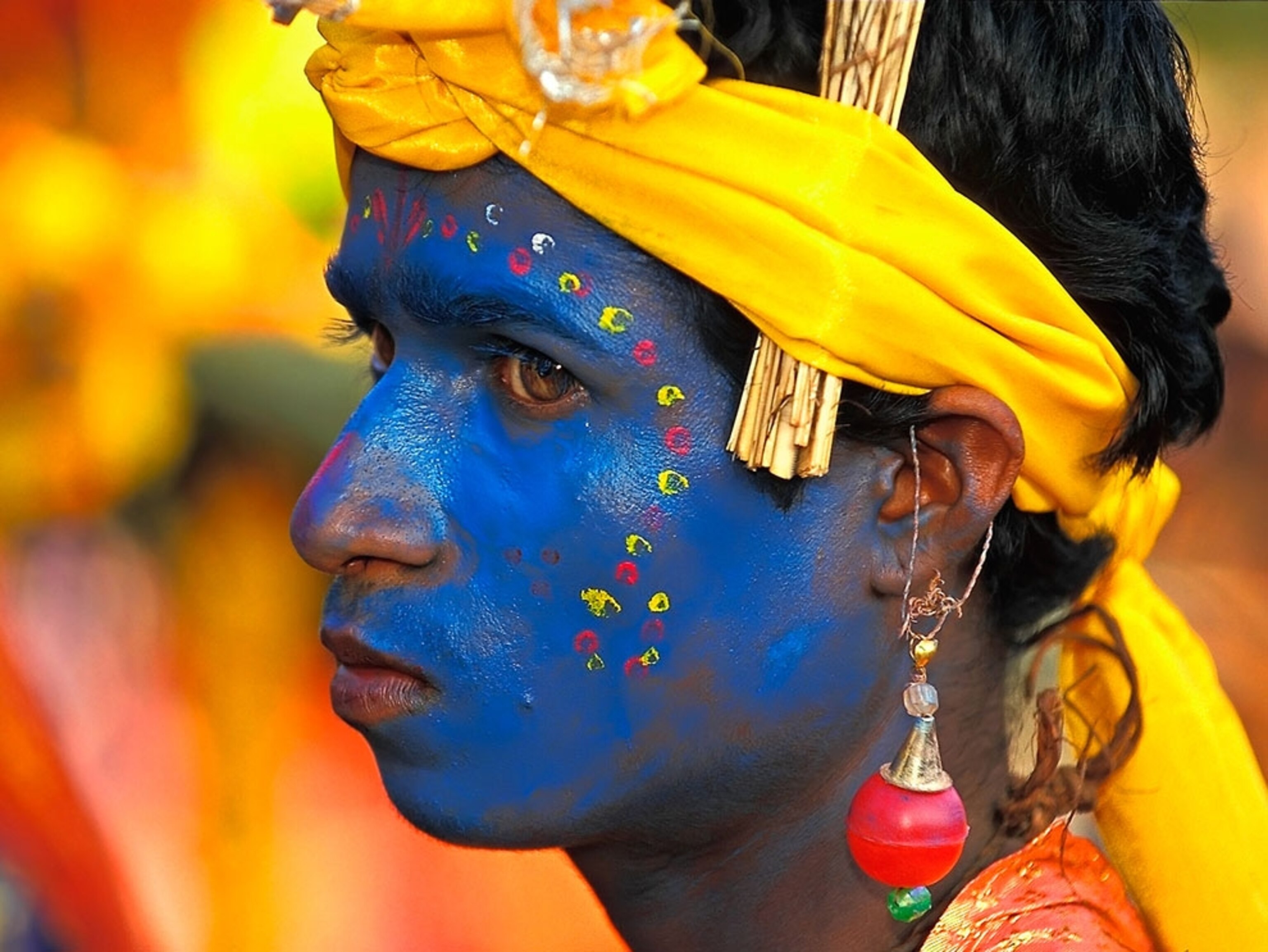 Man with blue paint on his face