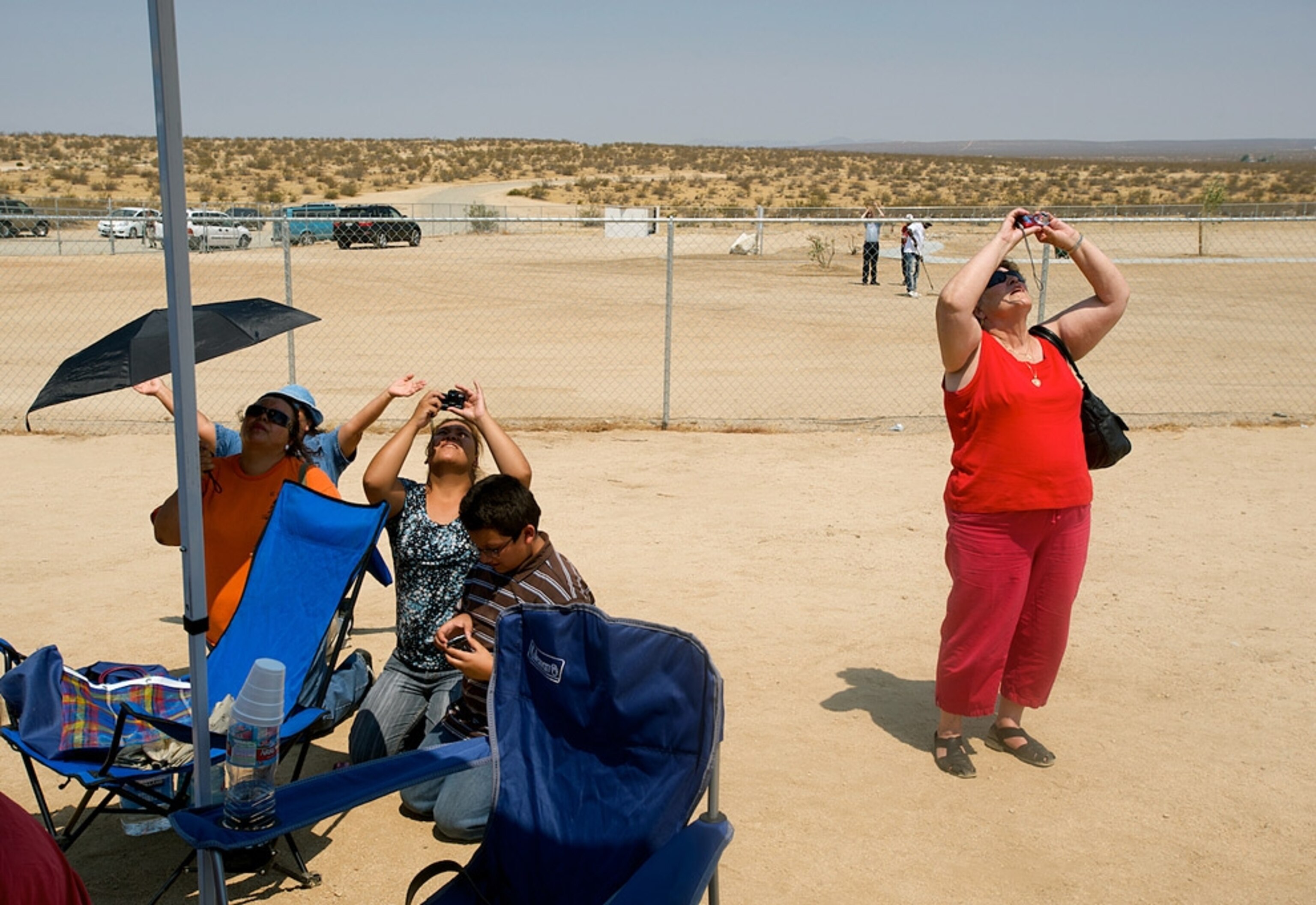 People taking photos of the sky