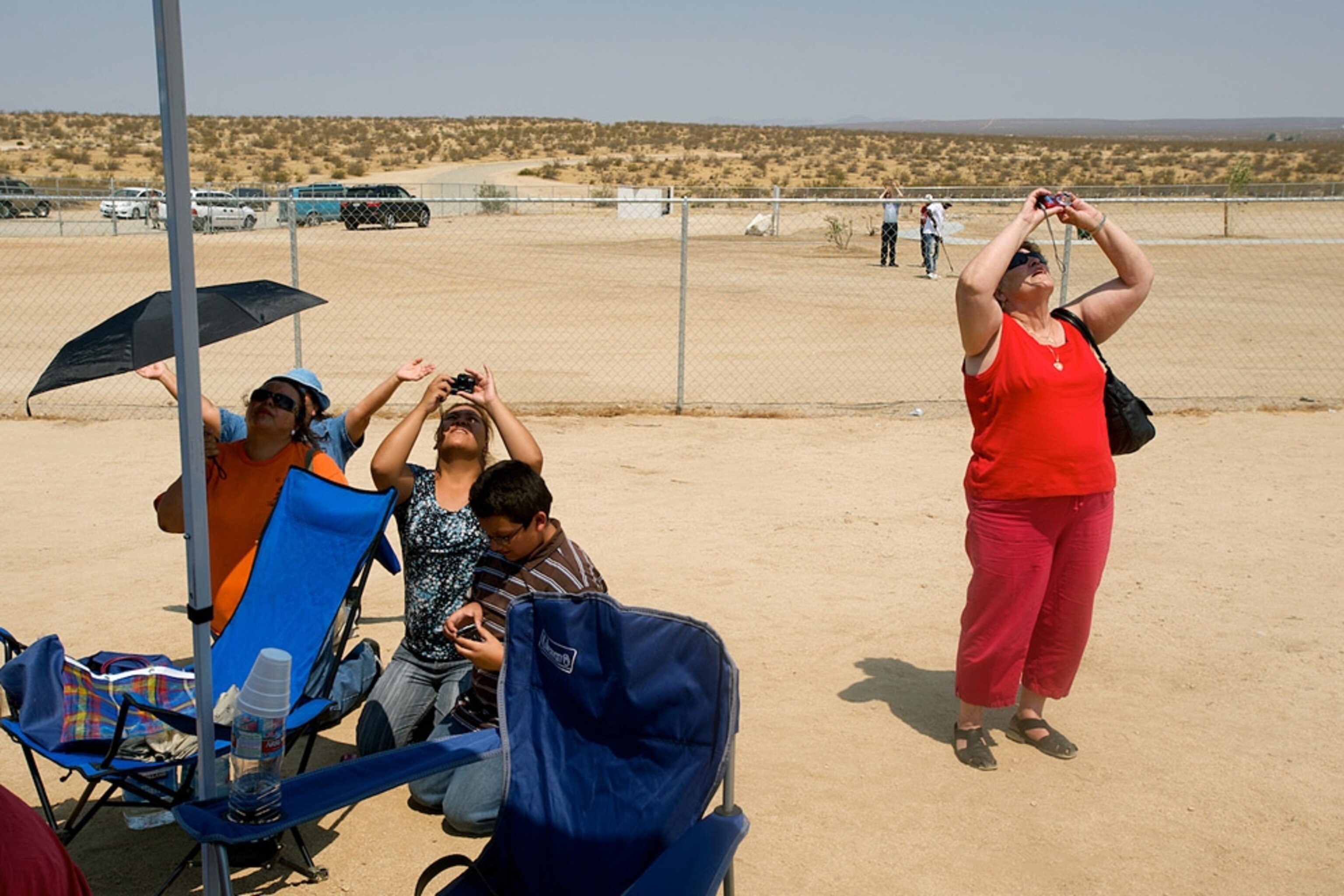 People taking photos of the sky