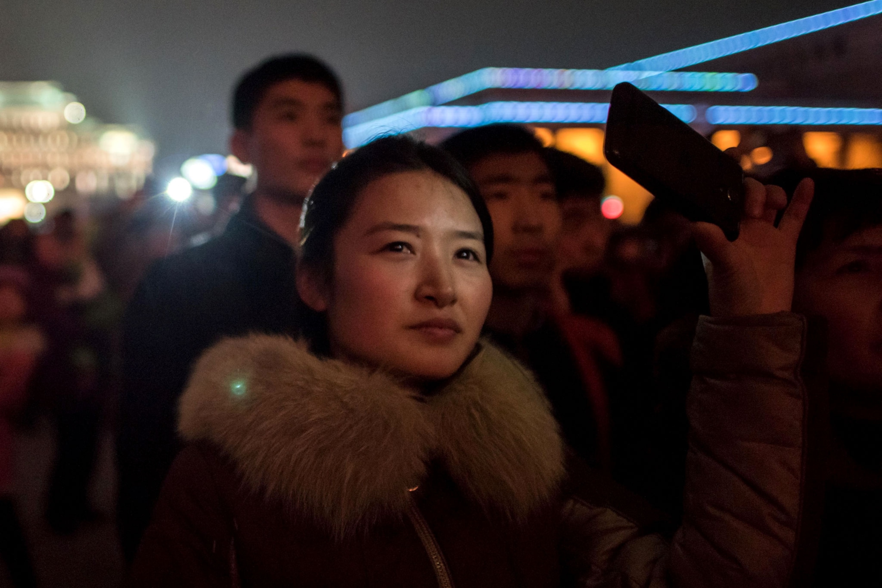 a woman watching fireworks in North Korea