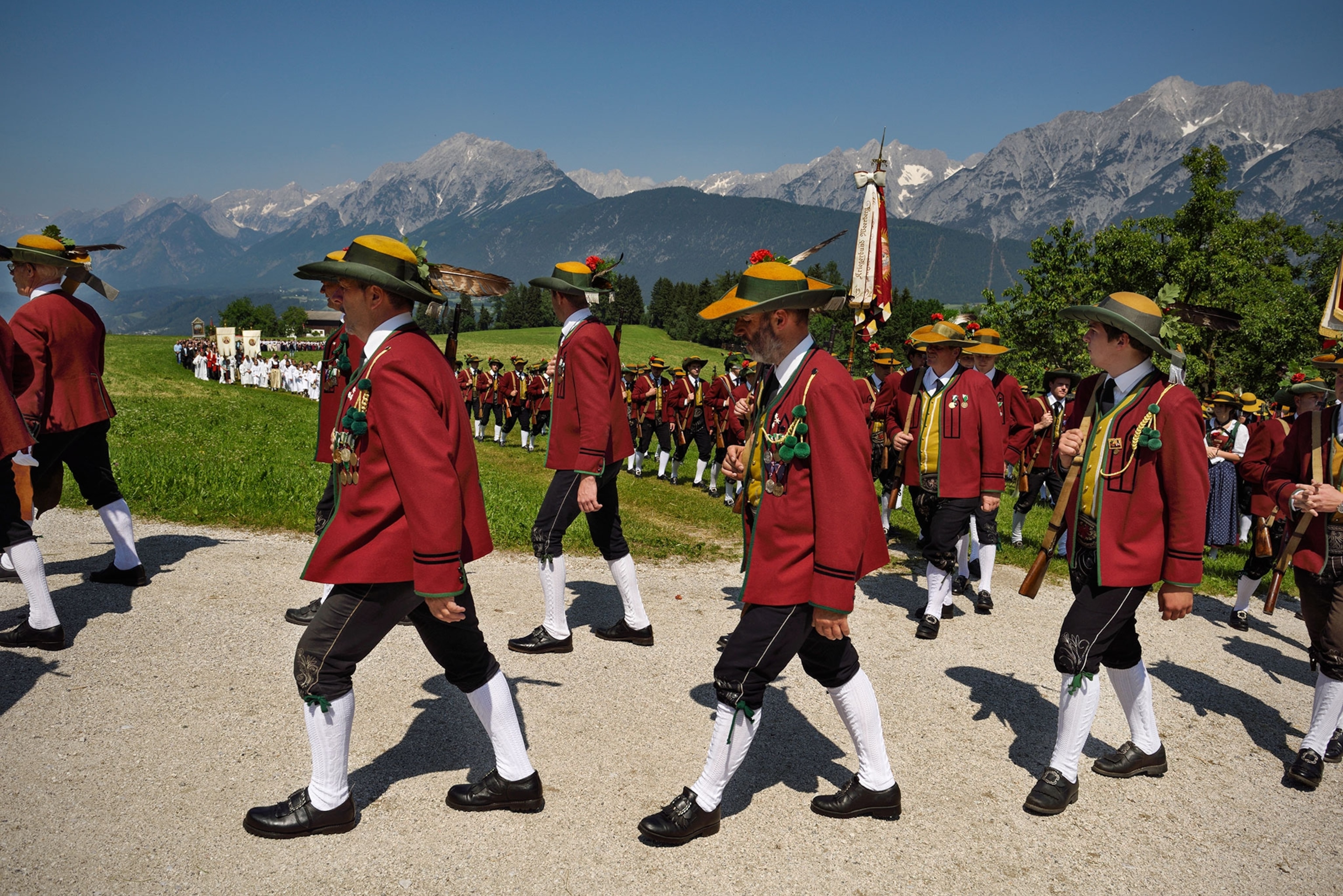 men walking in the Sacred Heart of Jesus procession