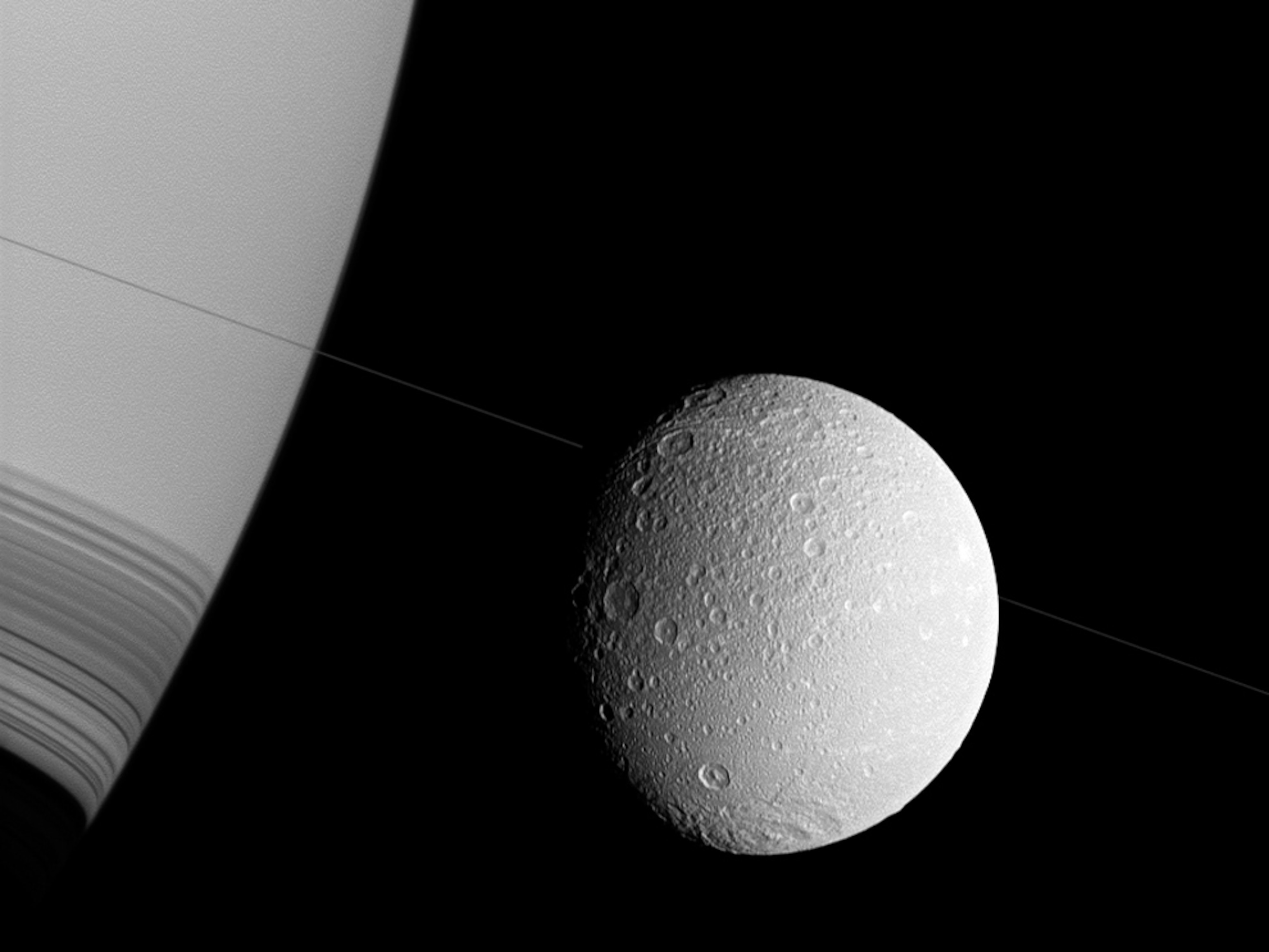 Saturn picture: the gas giant planet and its moon Dione